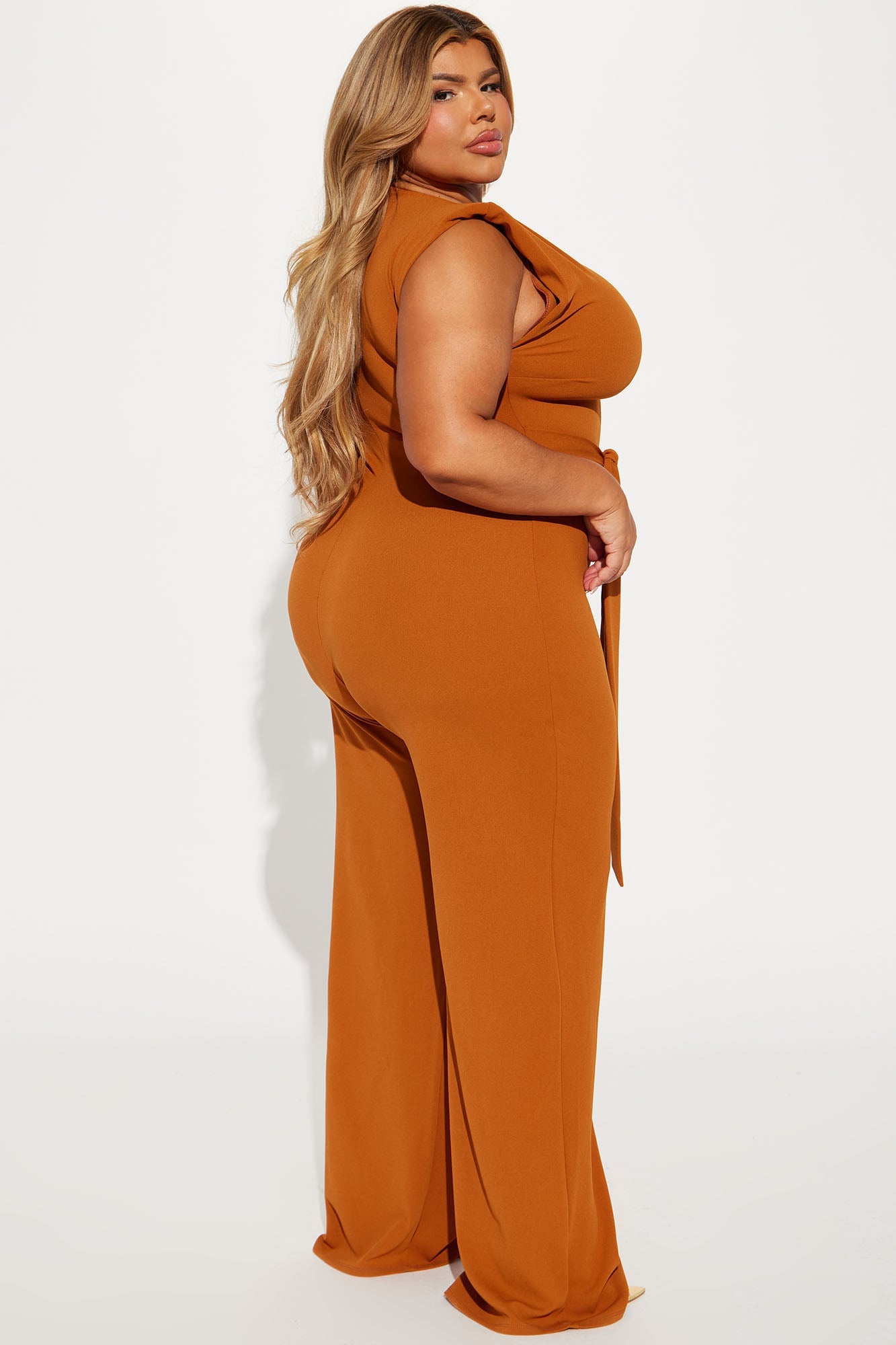 Stylish copper jumpsuit for women with a fitted design and side tie detail, perfect for any occasion