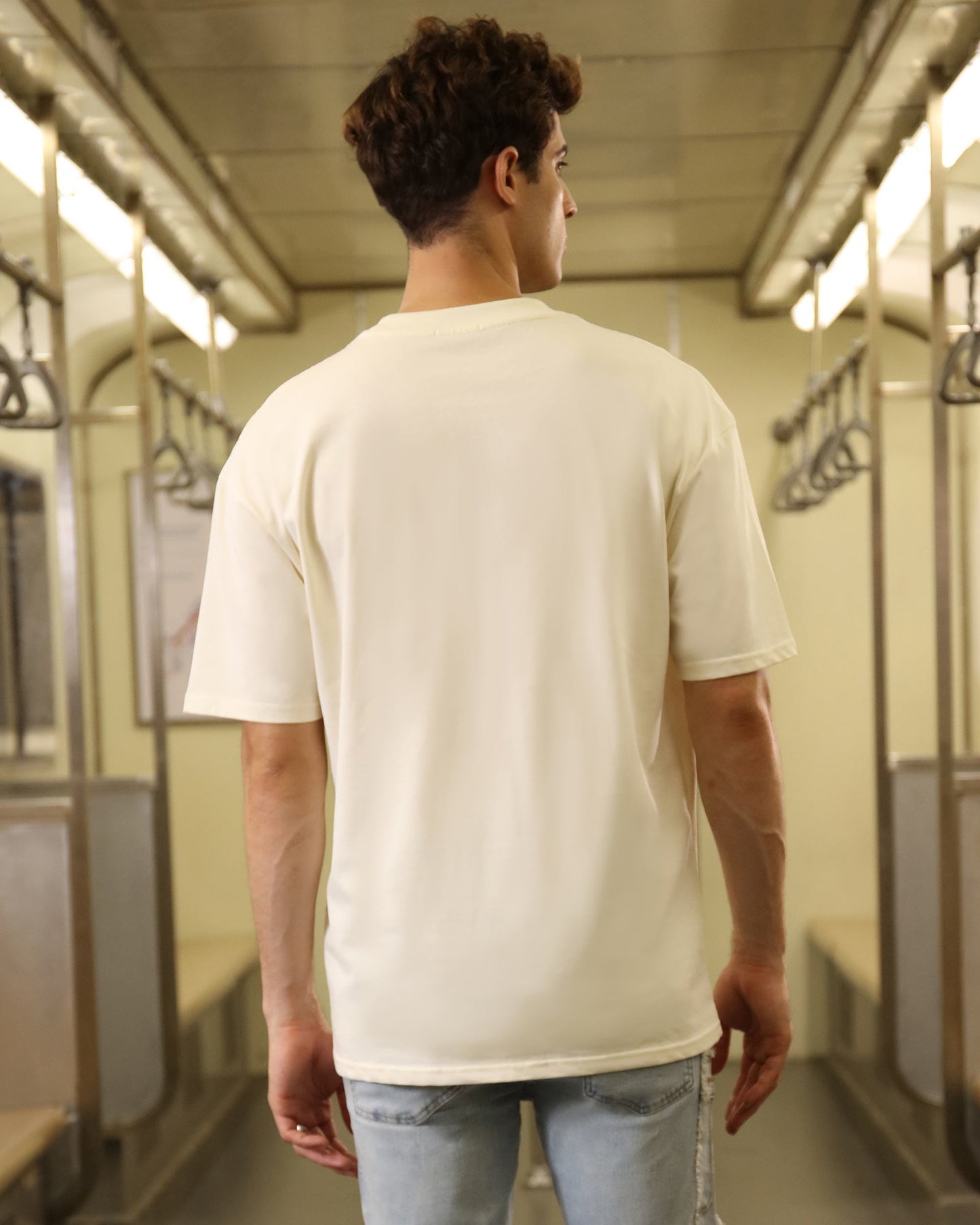 Cream oversized t-shirt for men, featuring a relaxed fit and soft fabric, perfect for casual outings