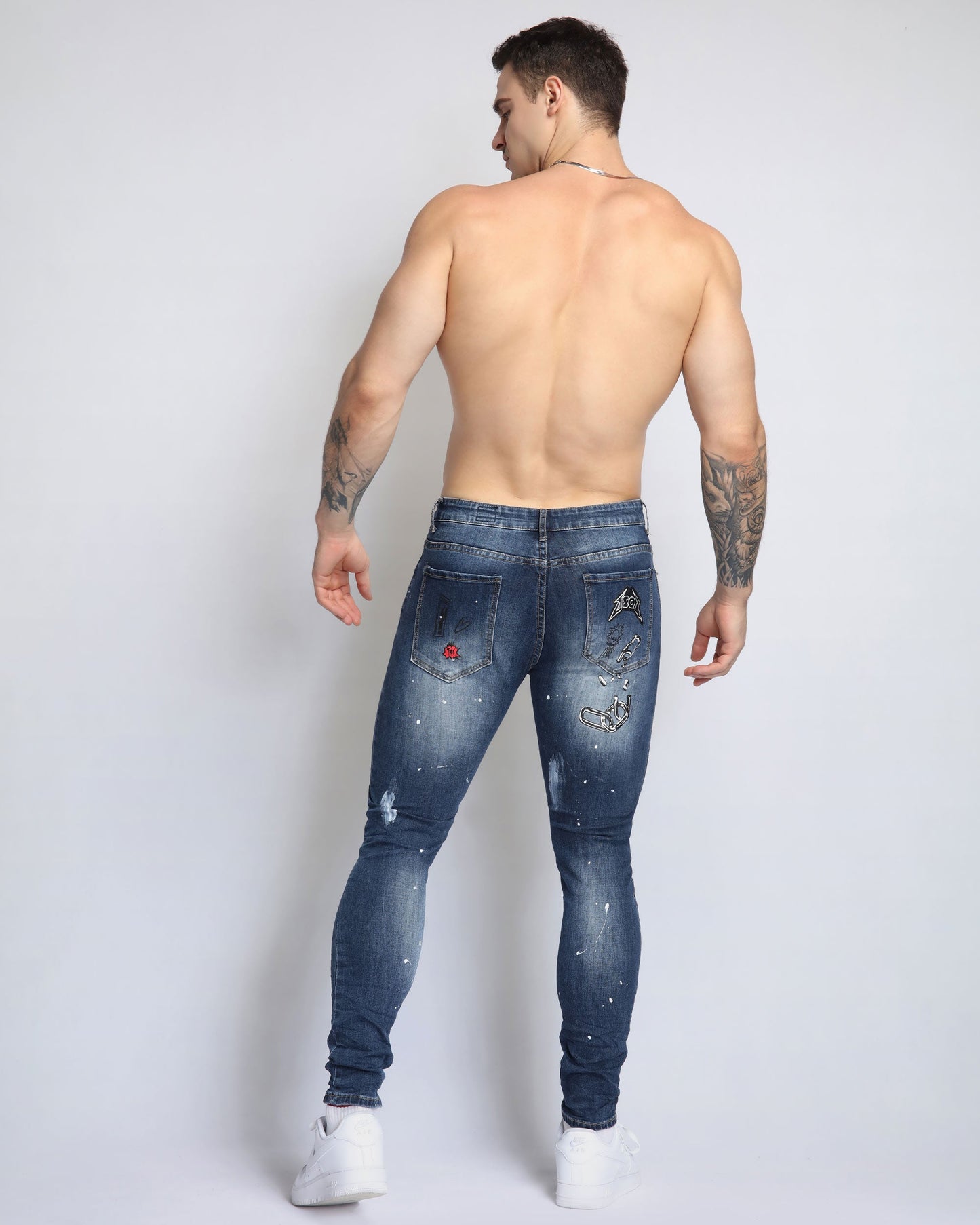 Logeqi dark blue graffiti jeans featuring a stylish distressed design and a fitted silhouette