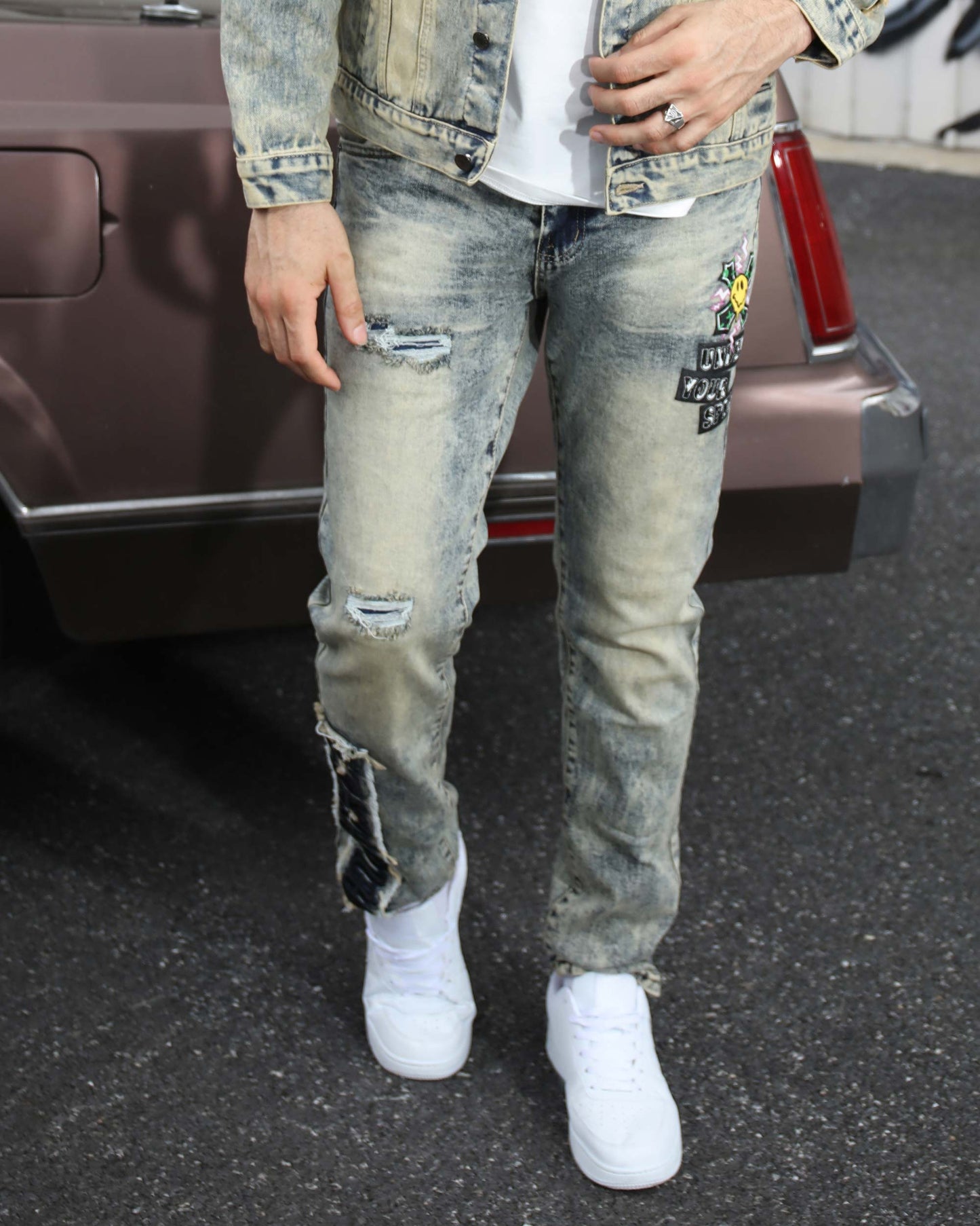 Logeqi dark washed straight leg jeans with distressed details and unique embellishments
