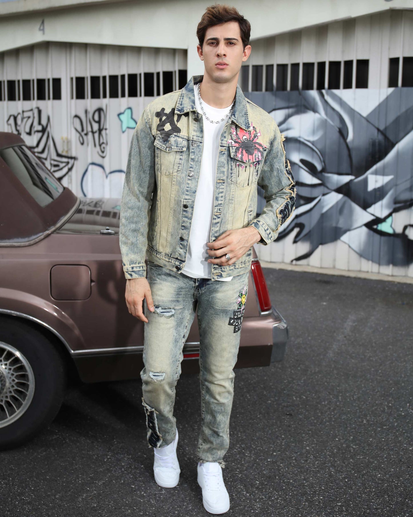 Logeqi dark washed straight leg jeans styled with a graphic denim jacket and white sneakers