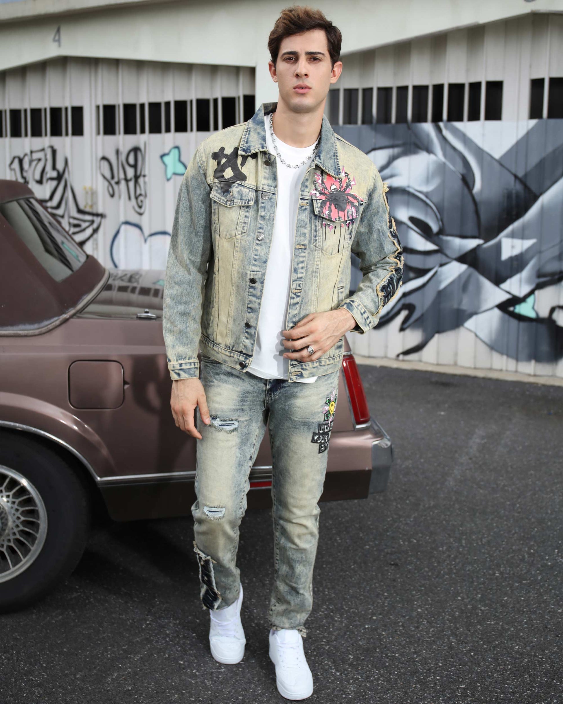 Logeqi dark washed straight leg jeans styled with a graphic denim jacket and white sneakers