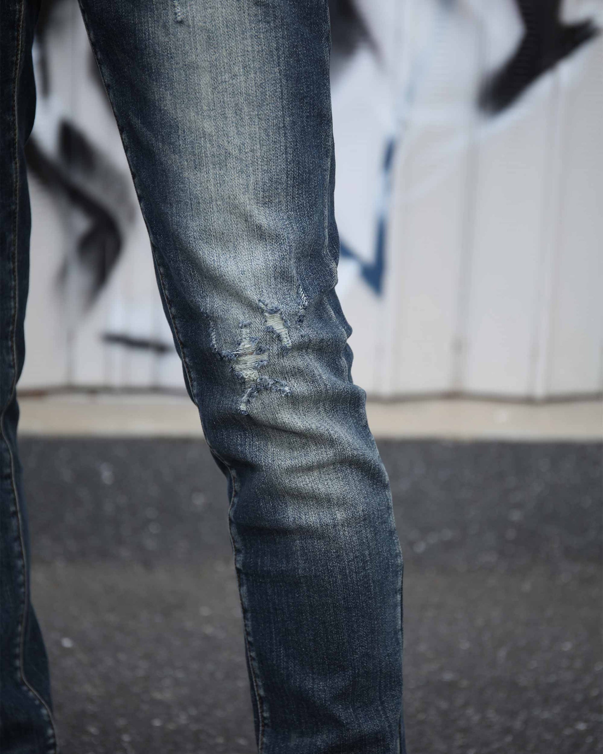 Logeqi slim fit ripped jeans men in dark wash with distressed detailing on knee