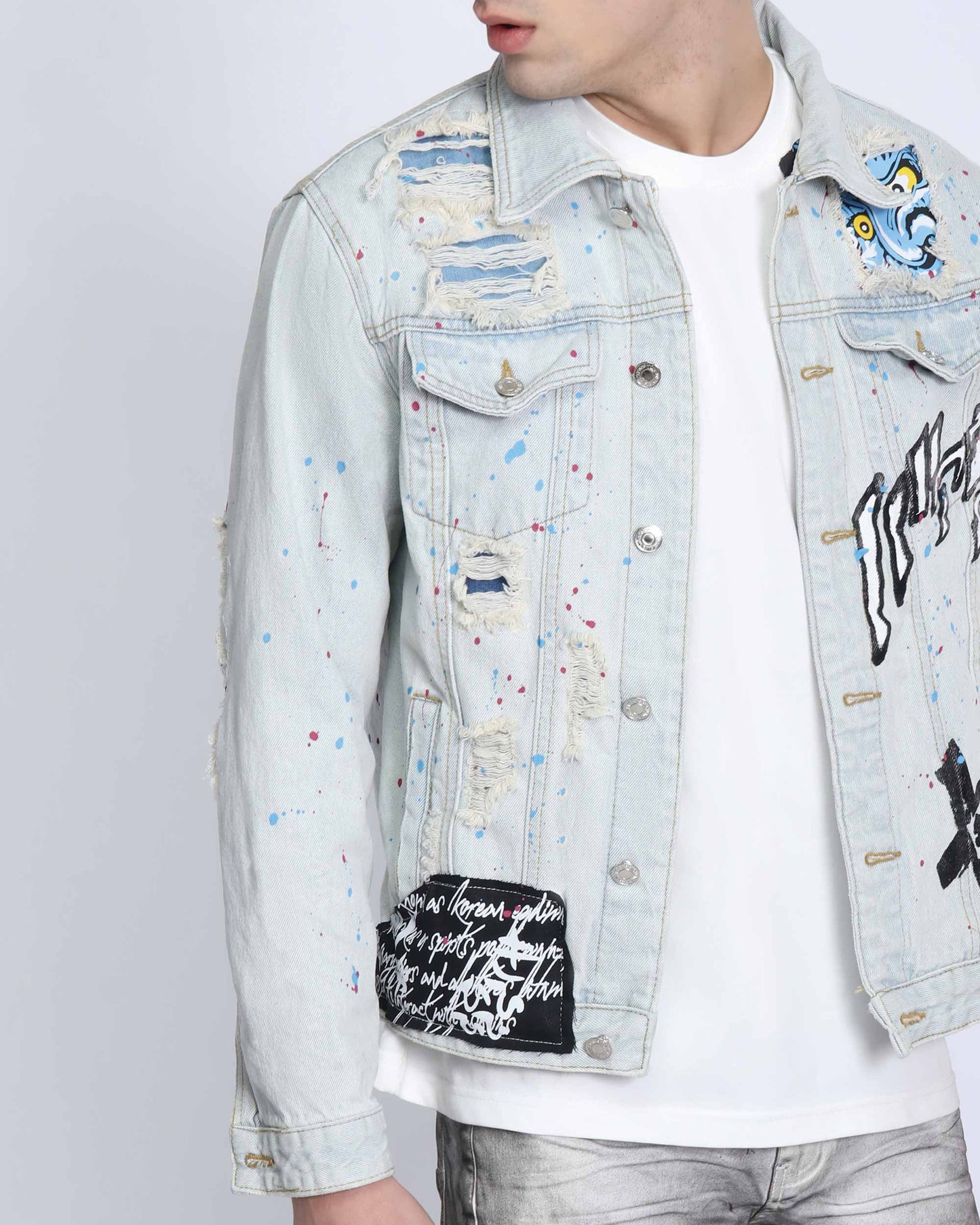 Logeqi distressed blue denim jacket with artistic splatter and distressed details for a trendy look
