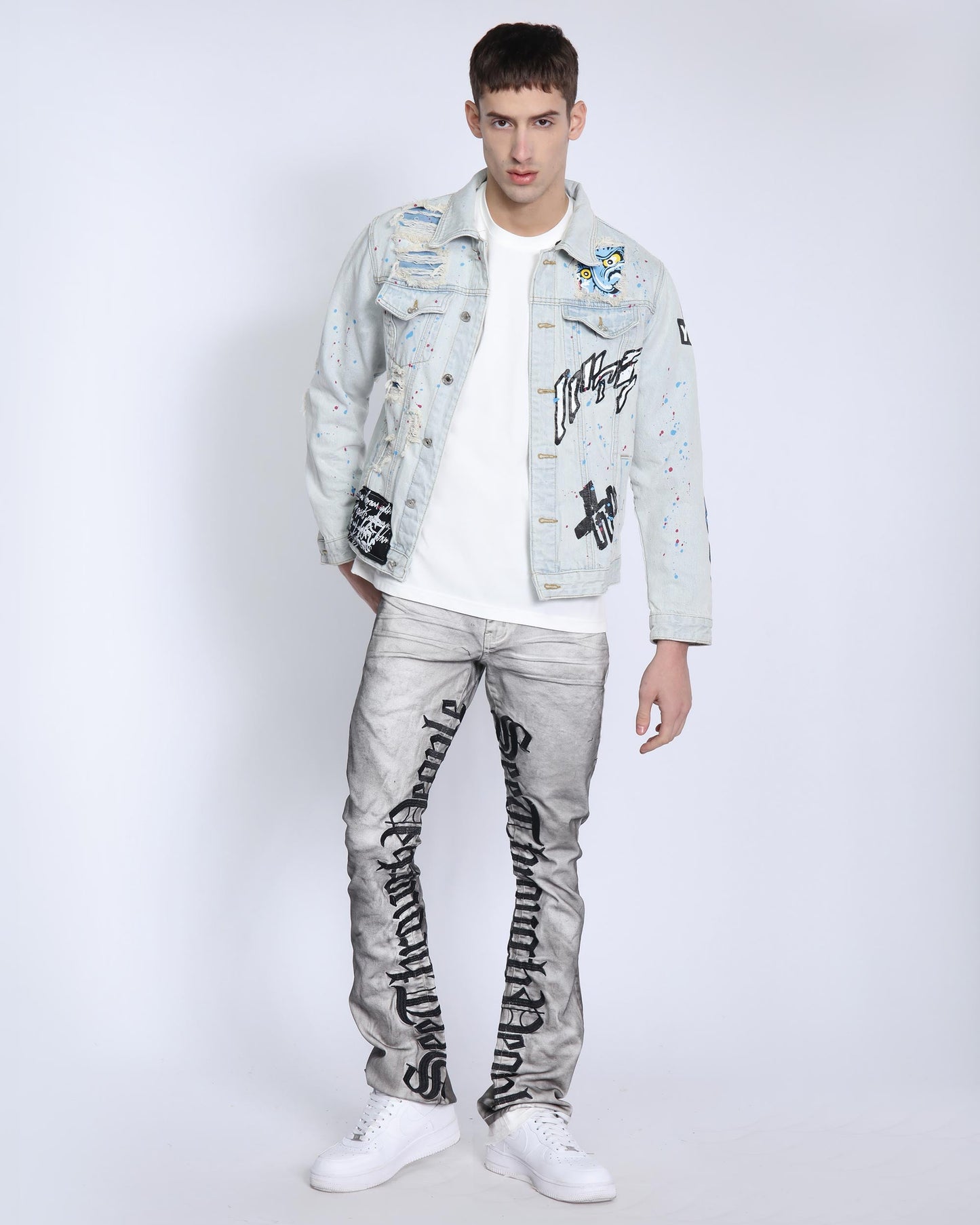 Logeqi distressed blue denim jacket with graffiti designs and a relaxed fit for casual style