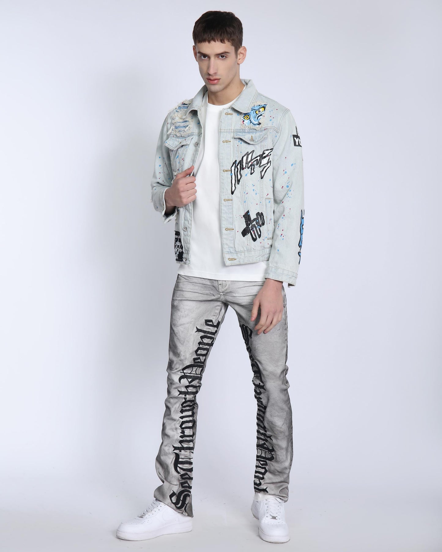 Logeqi distressed blue denim jacket featuring unique graphics and a modern fit