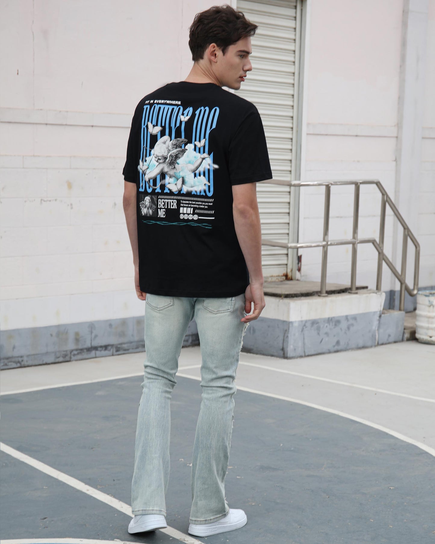 Logeqi distressed blue jeans styled with a black graphic t-shirt for a casual look