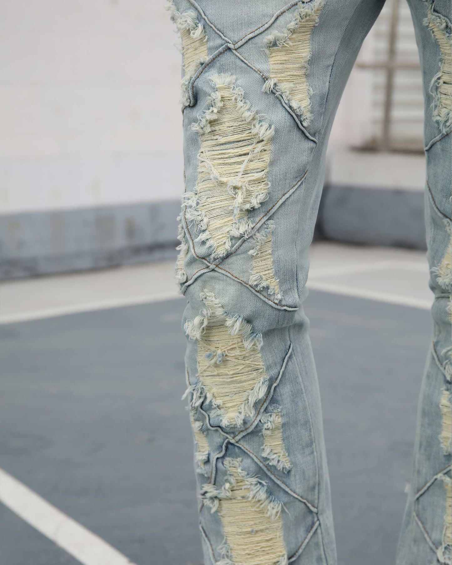 Logeqi distressed blue jeans with unique ripped design and frayed detailing for a stylish look