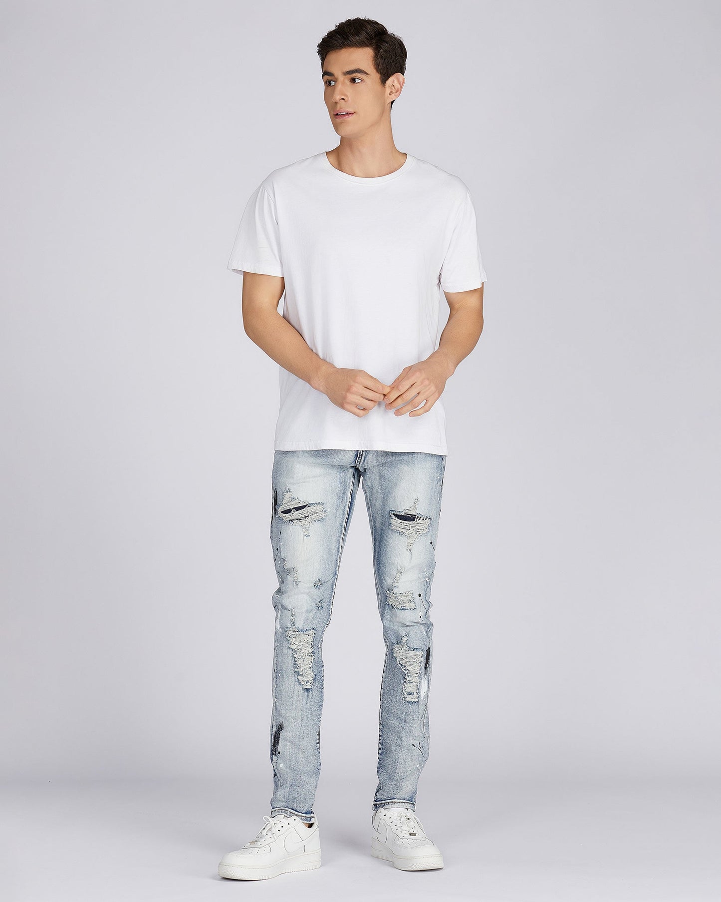 Logeqi distressed blue jeans for men featuring a slim fit and trendy ripped details