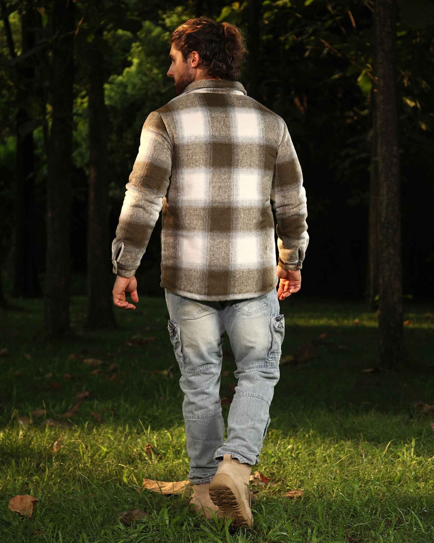 Men's Logeqi distressed cargo jeans in light wash worn outdoors with brown plaid jacket