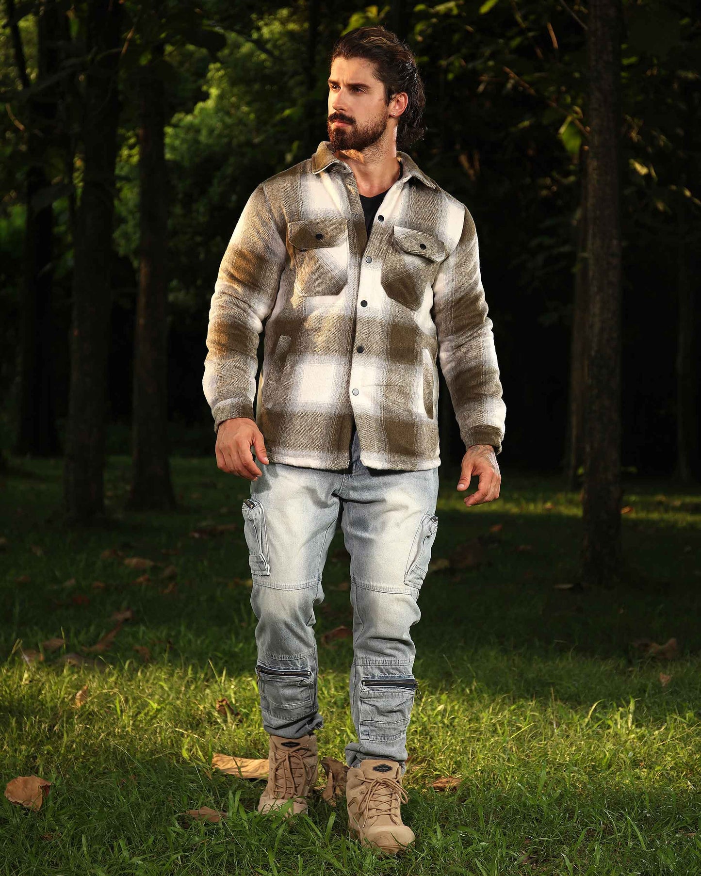 Logeqi distressed cargo jeans worn by bearded man with plaid shirt and boots in forest