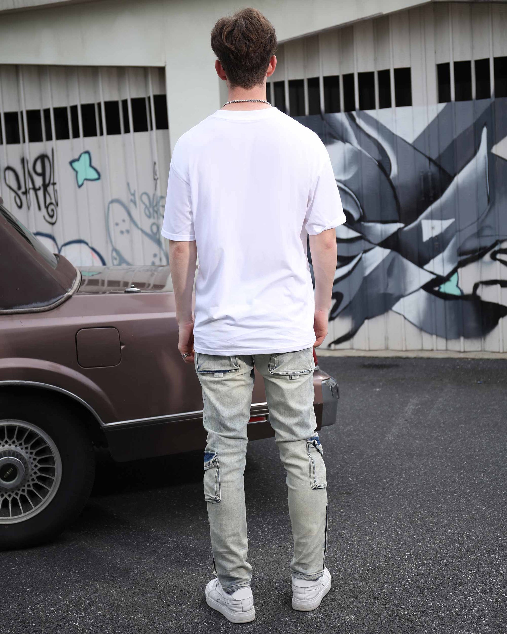 Logeqi distressed cargo jeans men in light gray worn by man standing outdoors near vintage car