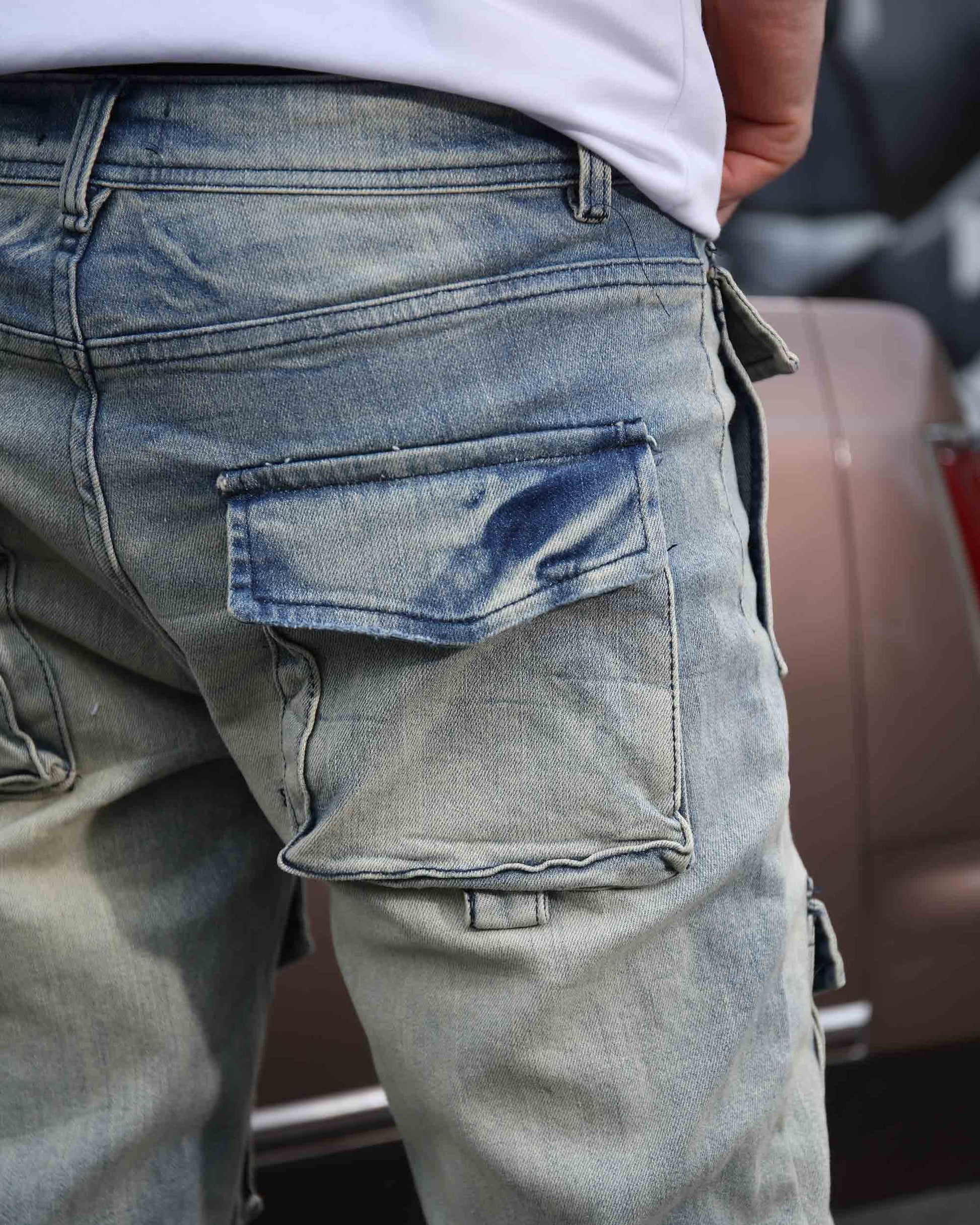 Logeqi distressed cargo jeans men in light blue denim with large side pocket and faded detailing