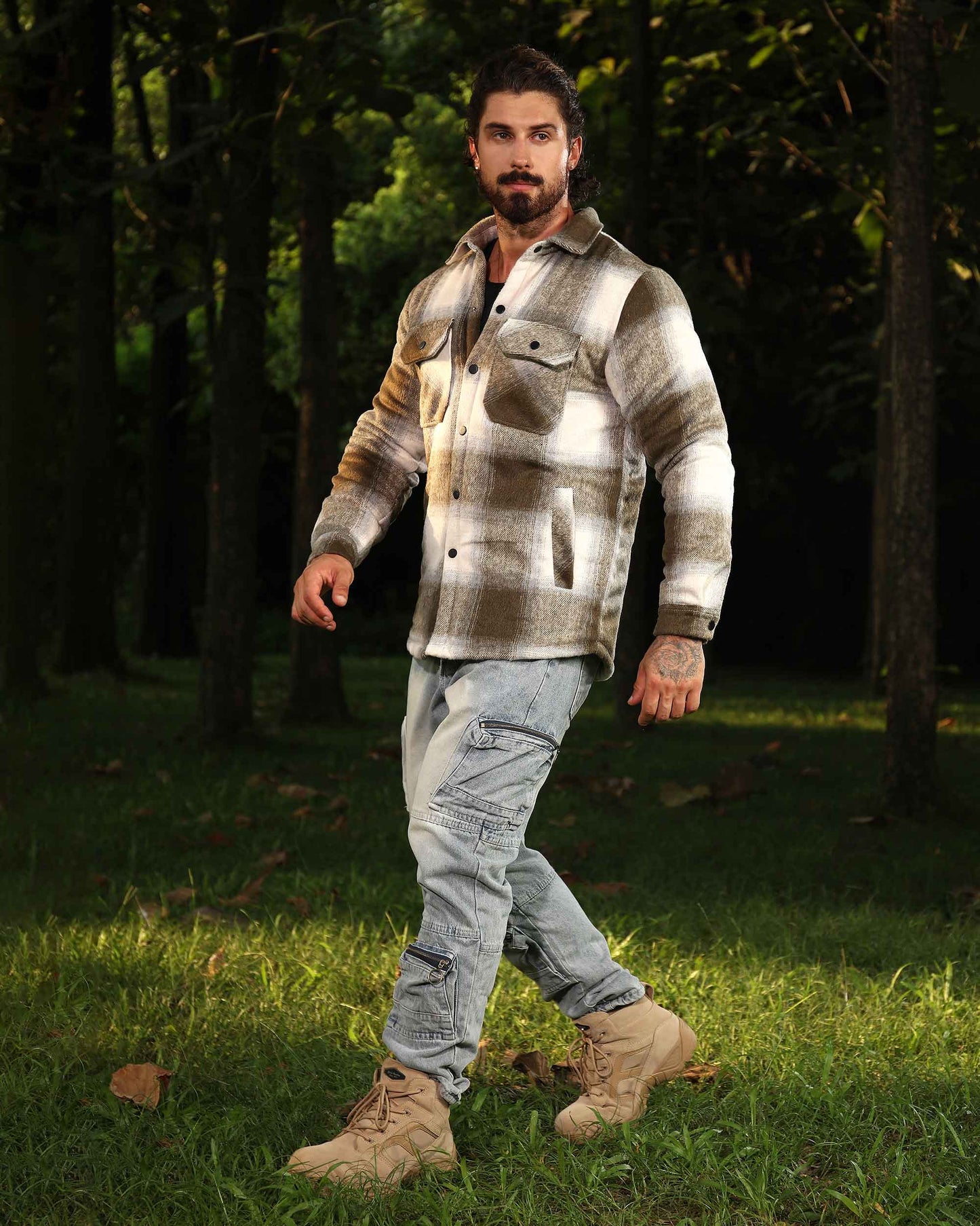 Logeqi distressed cargo jeans worn by man with beige boots and plaid shirt in forest setting