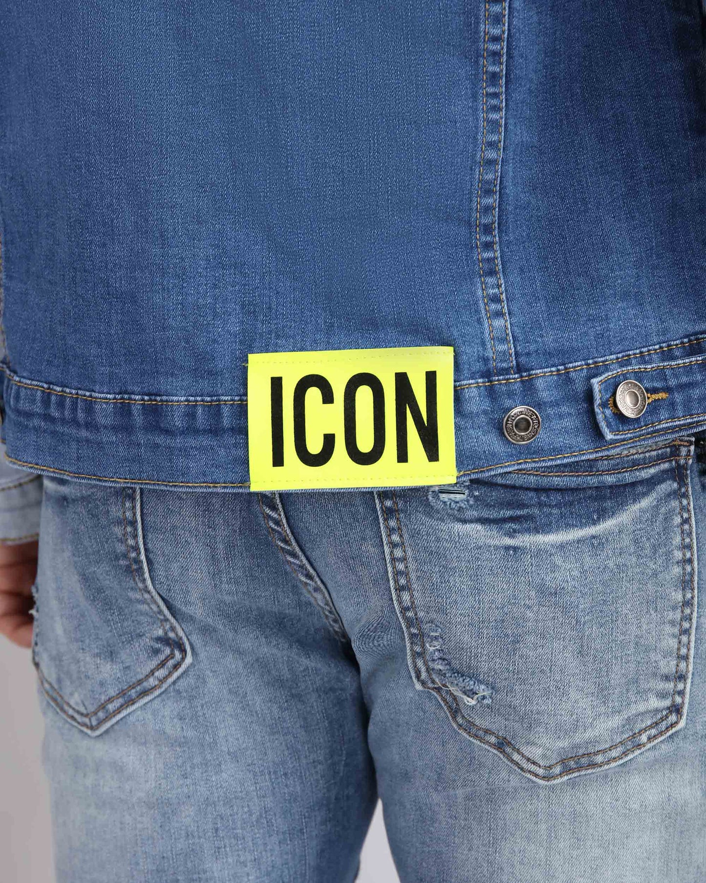 Logeqi distressed denim jacket ICON patch with bright yellow label on the back for a trendy look