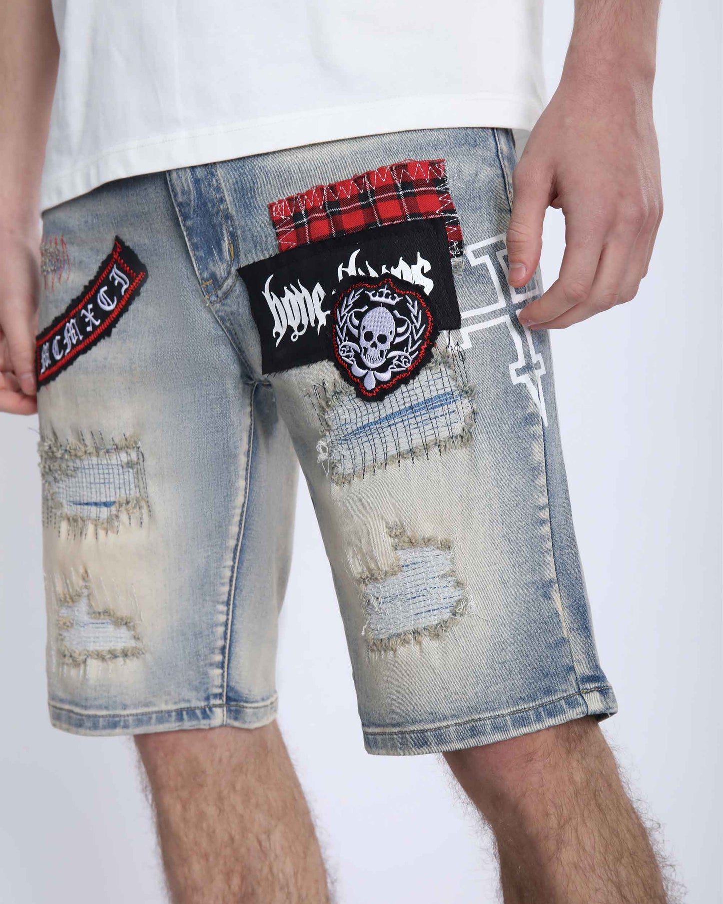 Logeqi distressed denim shorts men with ripped detailing and unique patches on light blue fabric