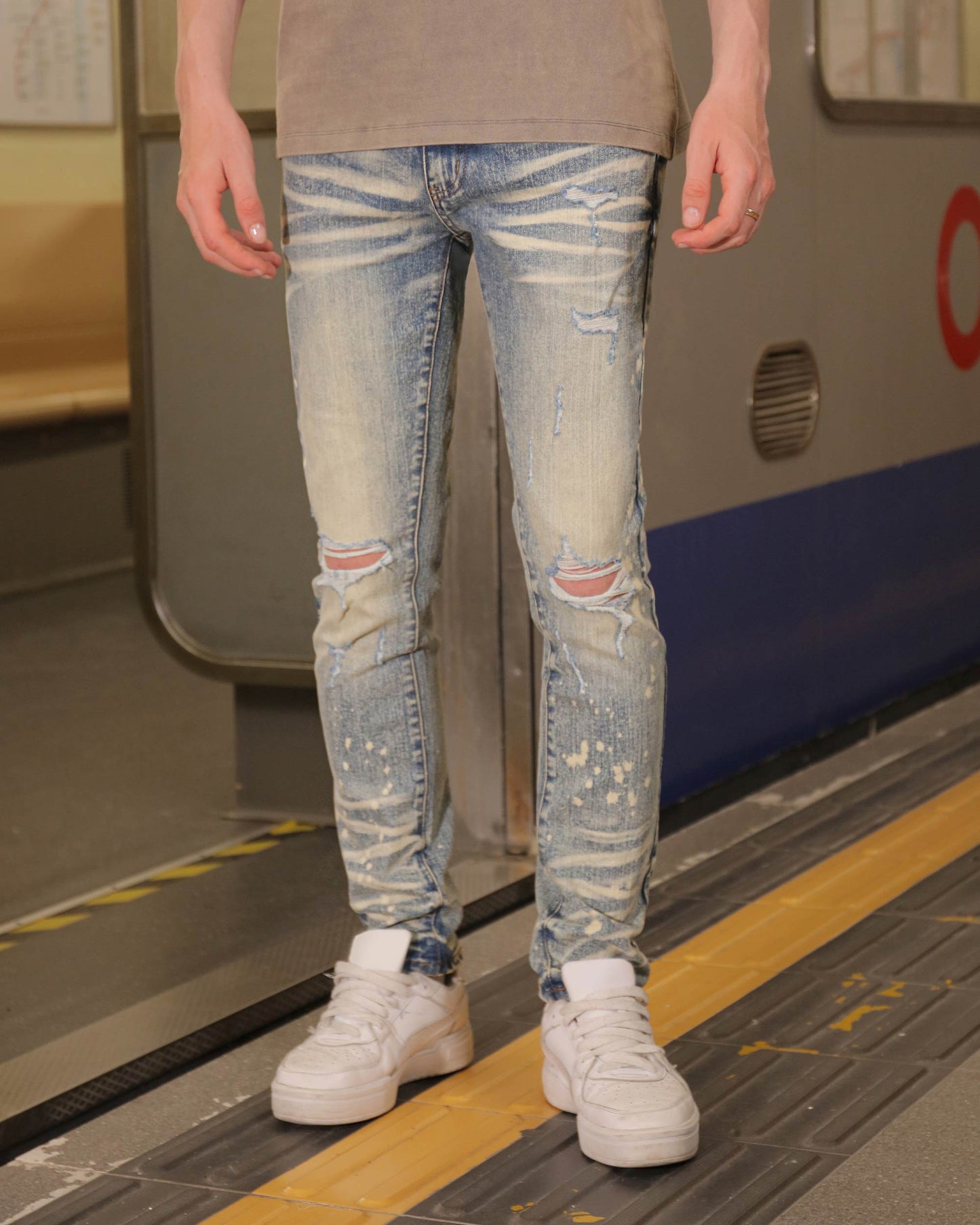 Logeqi distressed whiskered blue jeans with rips and a faded finish for a trendy look