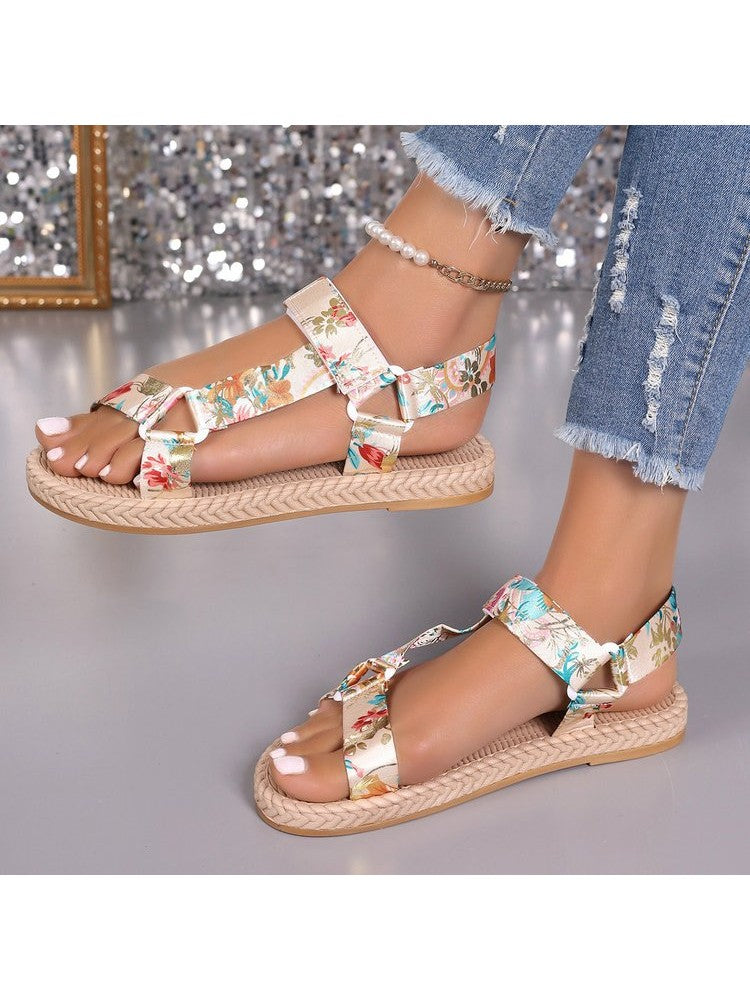 Wholesale7 floral print flat sandals with adjustable straps worn with distressed jeans