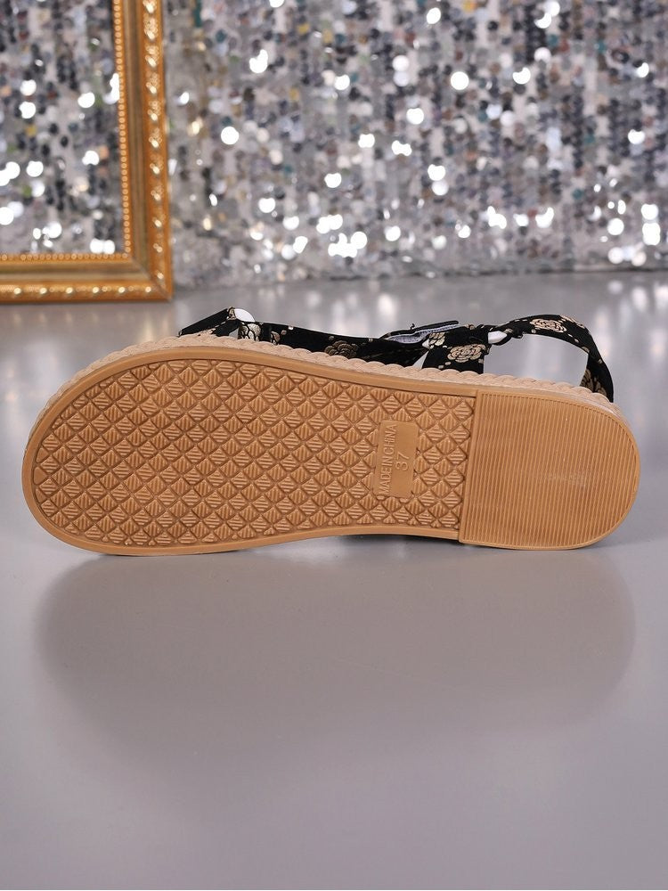 Wholesale7 floral print flat sandals showing textured rubber sole for grip and comfort