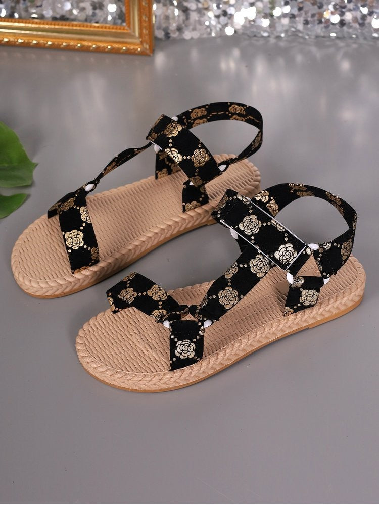 Wholesale7 floral print flat sandals with black straps and beige braided sole for casual wear