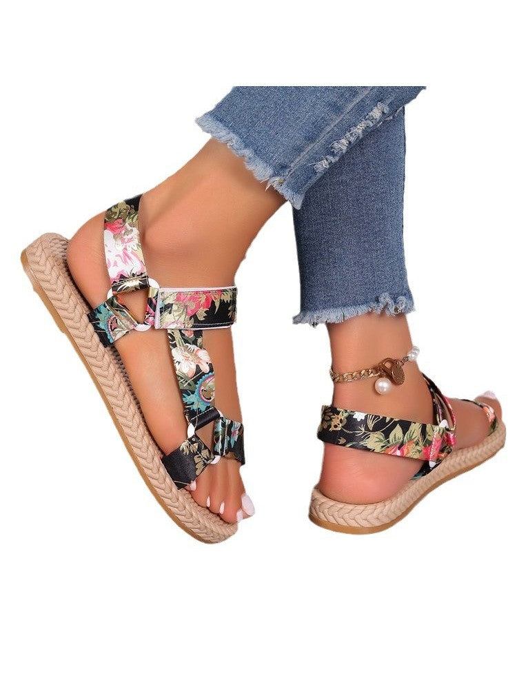 Wholesale7 floral print flat sandals with adjustable straps and braided sole worn with frayed hem jeans