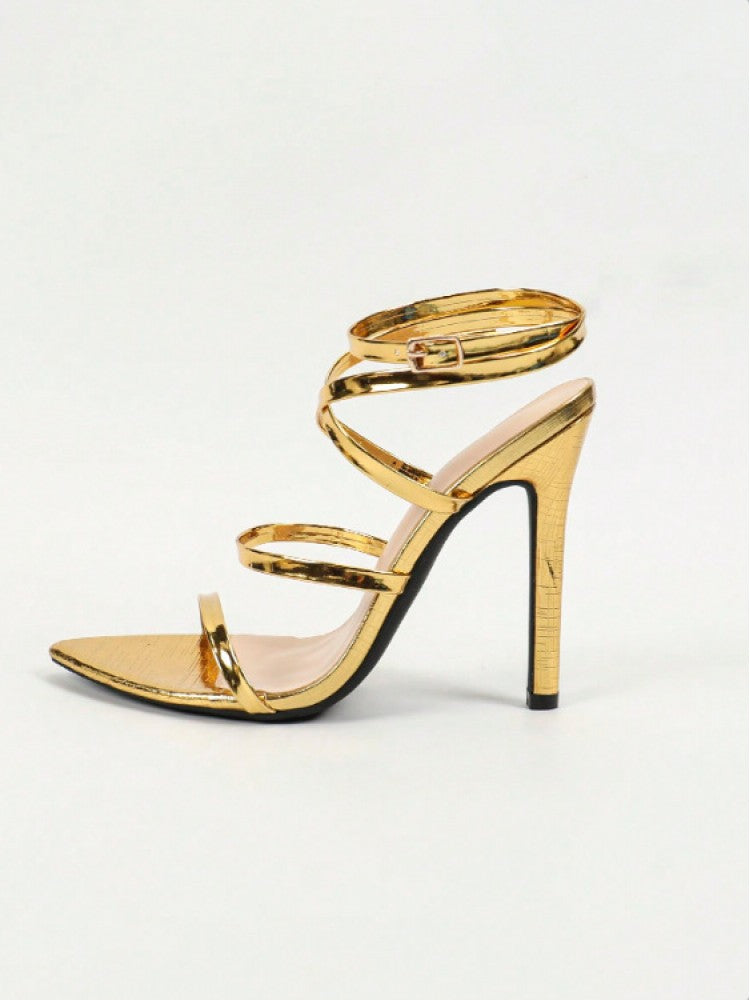 Elegant gold flower stiletto sandals with multiple straps and a sleek high heel