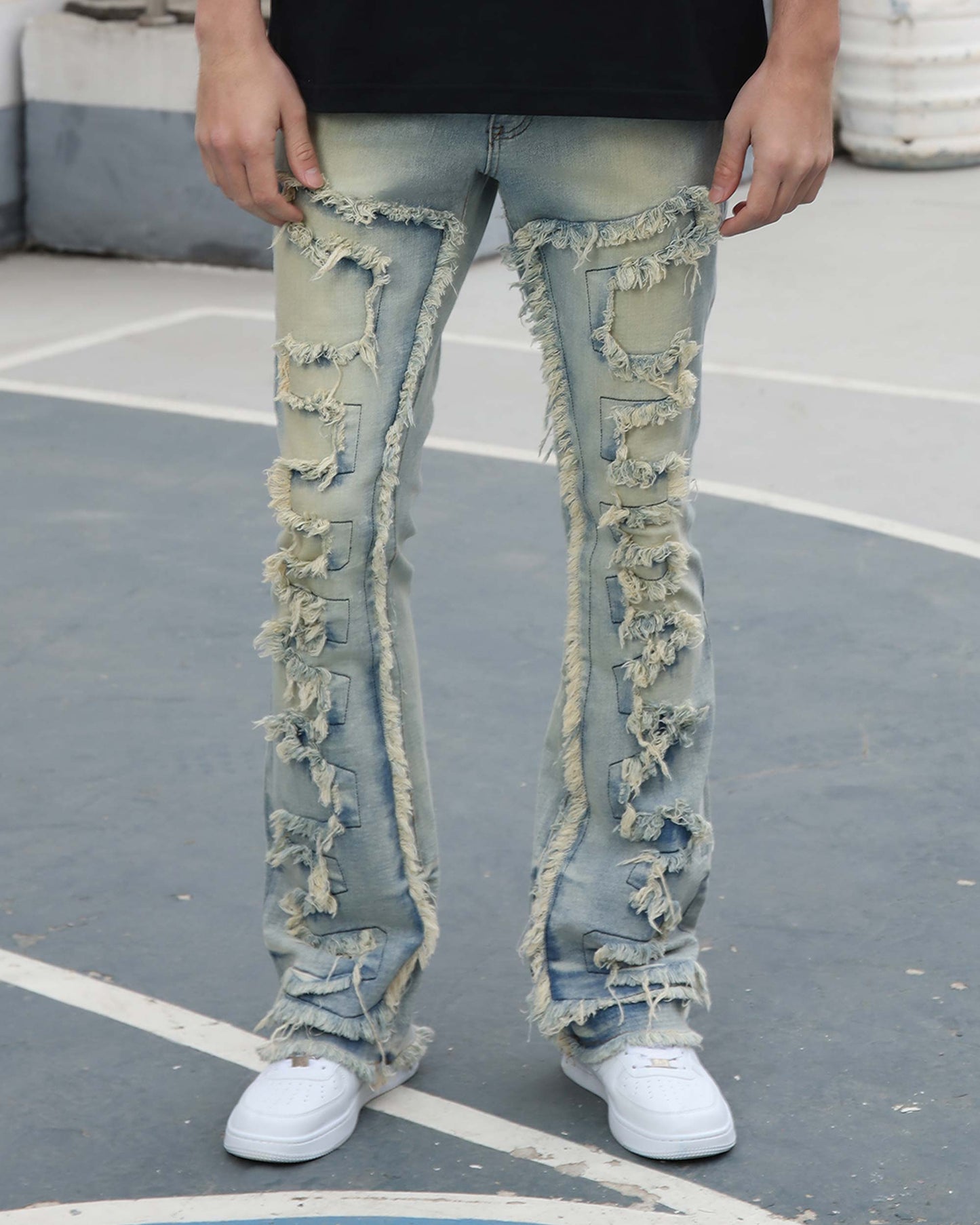 Logeqi fringe flared jeans in light blue denim with distressed fringes down the front and sides