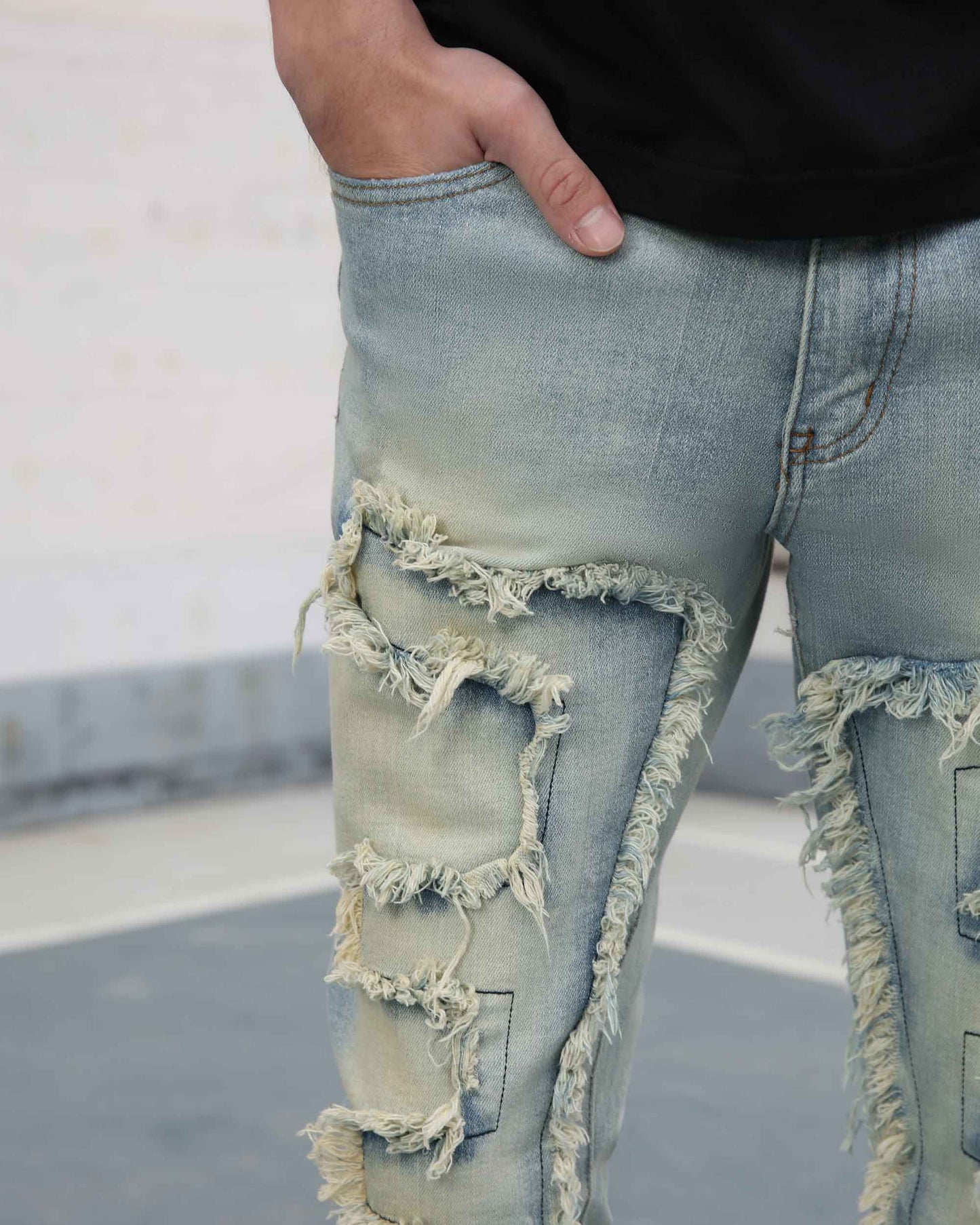 Logeqi fringe flared jeans light wash with distressed frayed detailing on front thigh