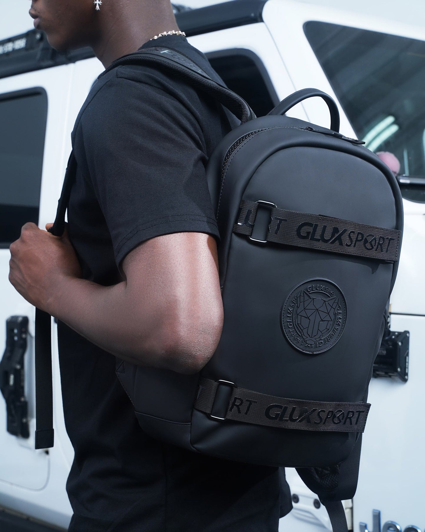 GLUX men's backpack in sleek black design featuring adjustable straps and logo detail