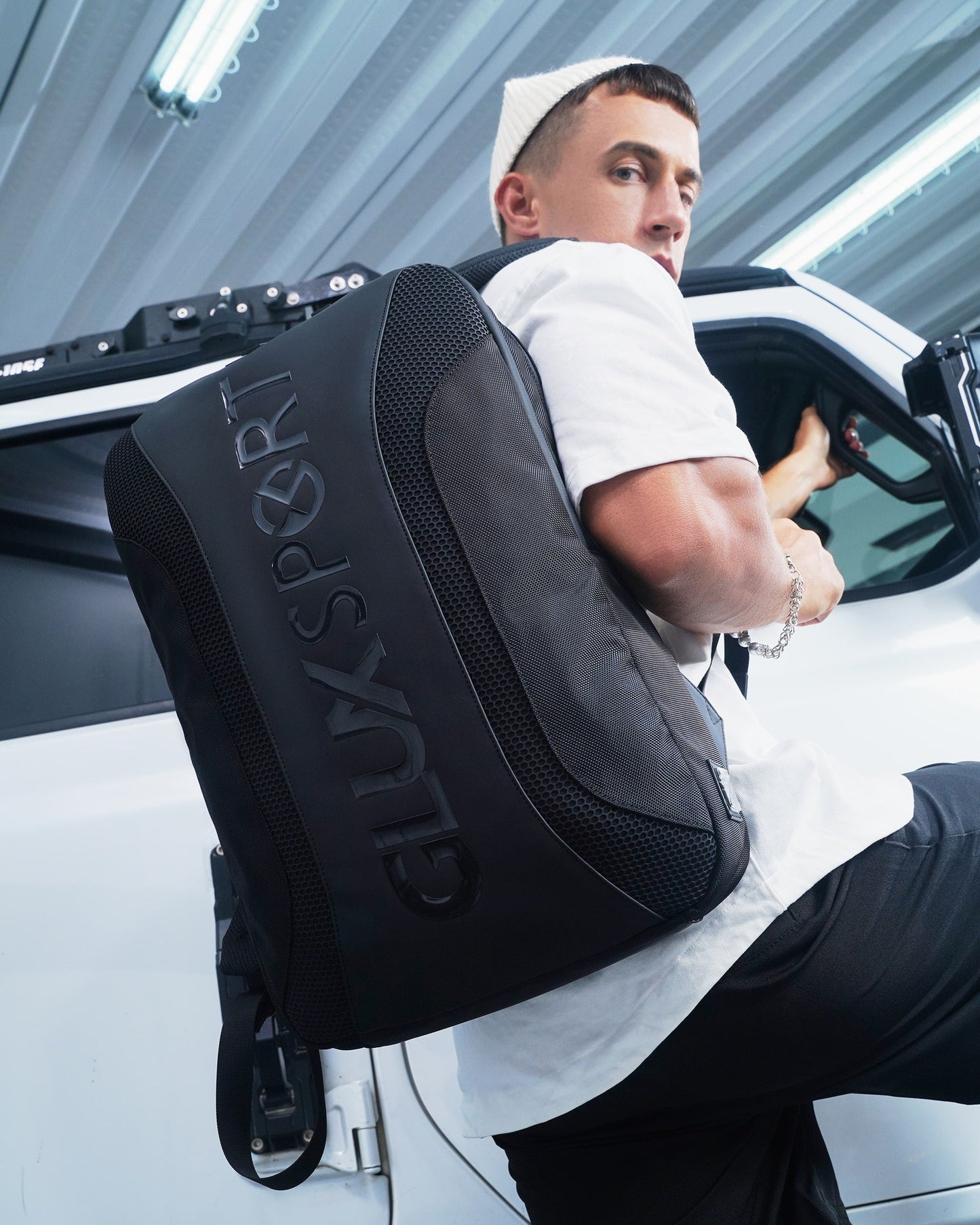 GLUX men's sports backpack in black worn by a model, perfect for active lifestyles