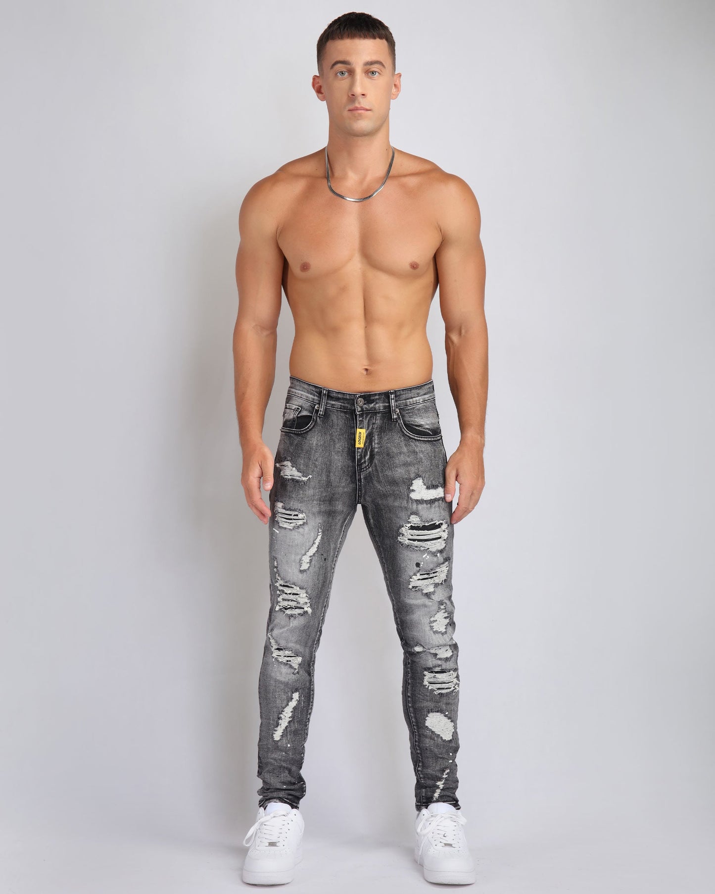 Stylish Logeqi graffiti ripped jeans in distressed black with a slim fit for a trendy look