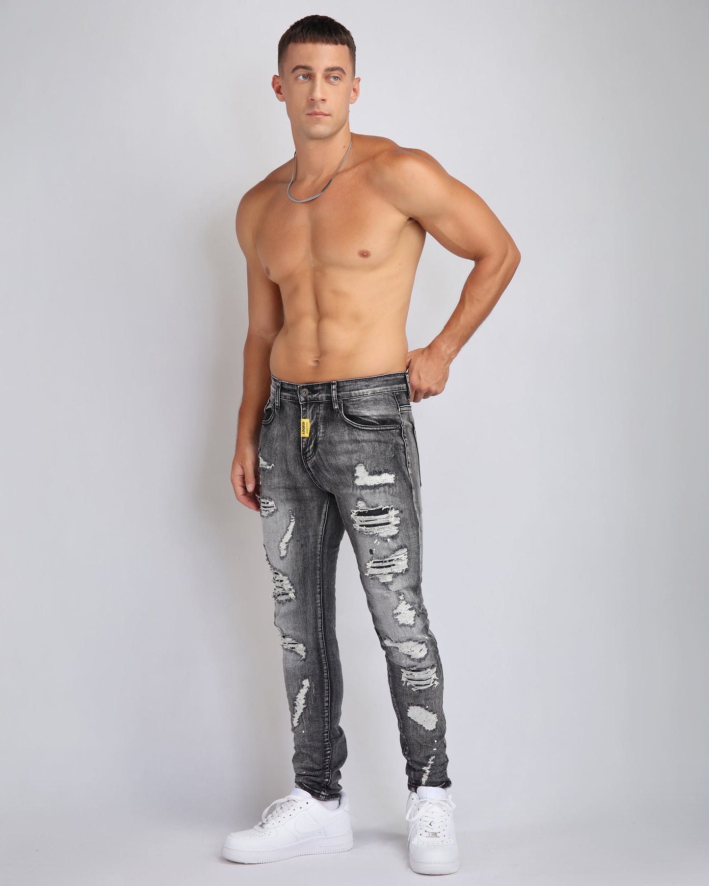Logeqi graffiti ripped jeans in grey with stylish distressed detailing and a slim fit design
