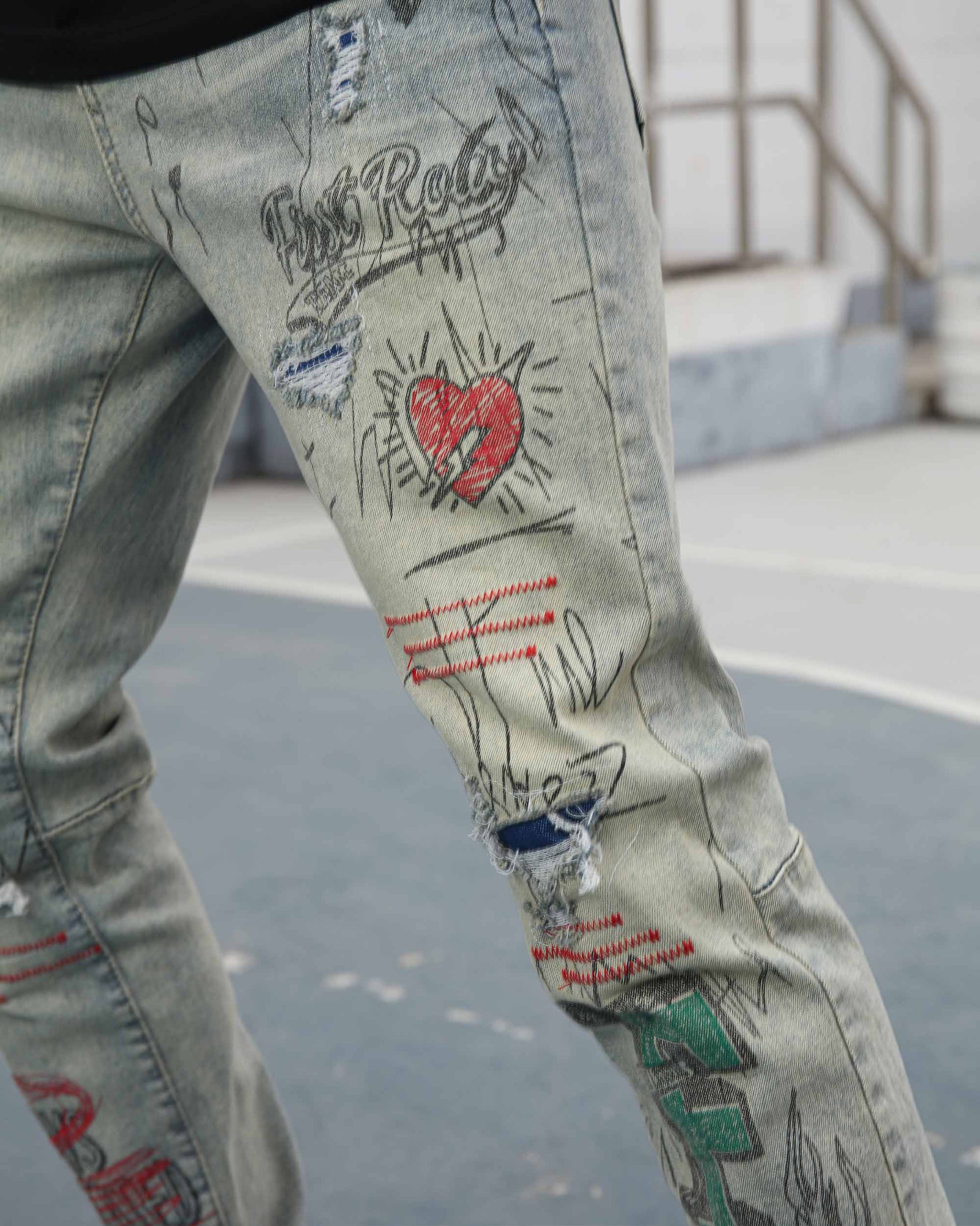 Logeqi graffiti ripped jeans featuring artistic designs and distressed details for a trendy look