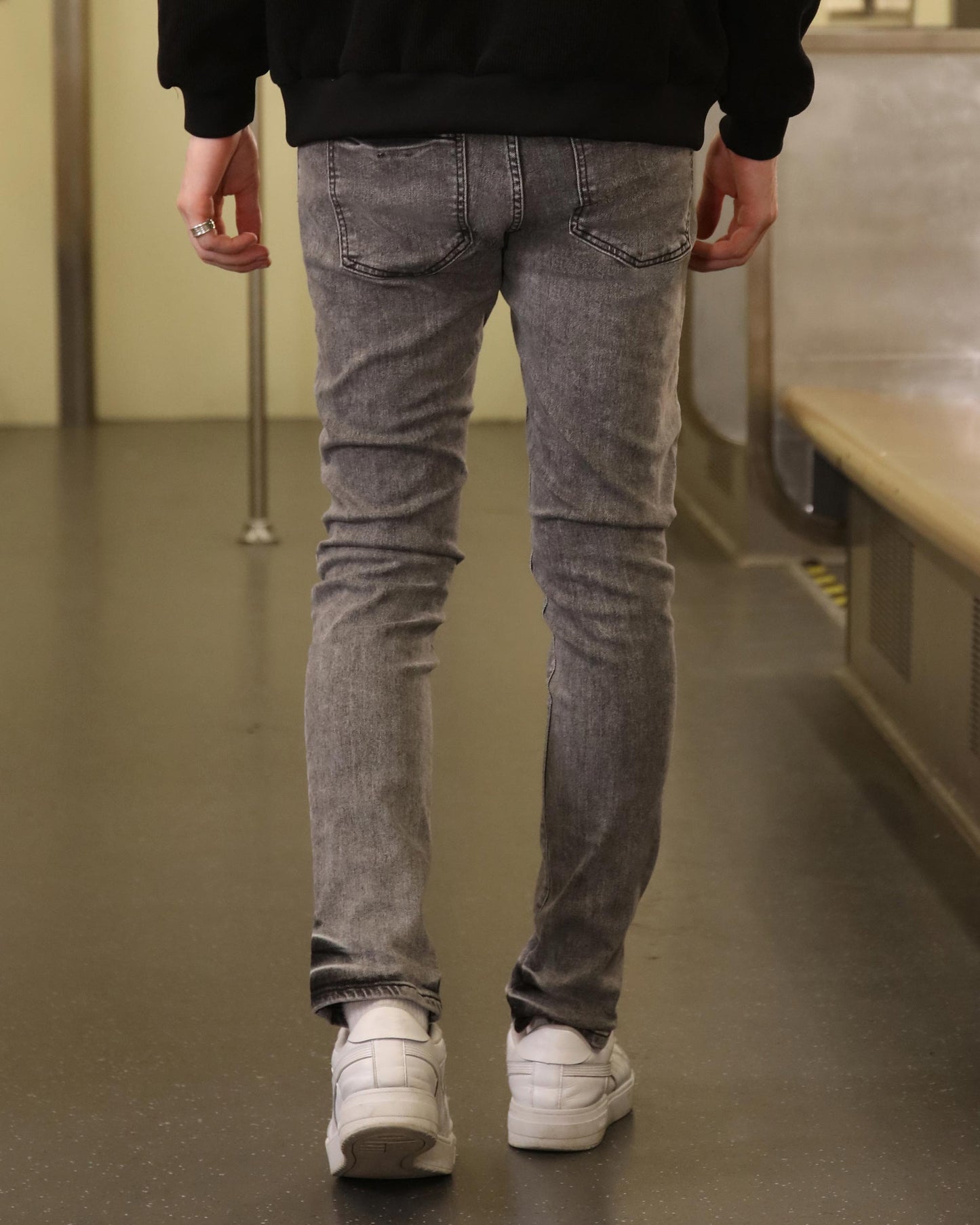 Logeqi gray ripped jeans men styled slim fit with casual white sneakers in urban setting