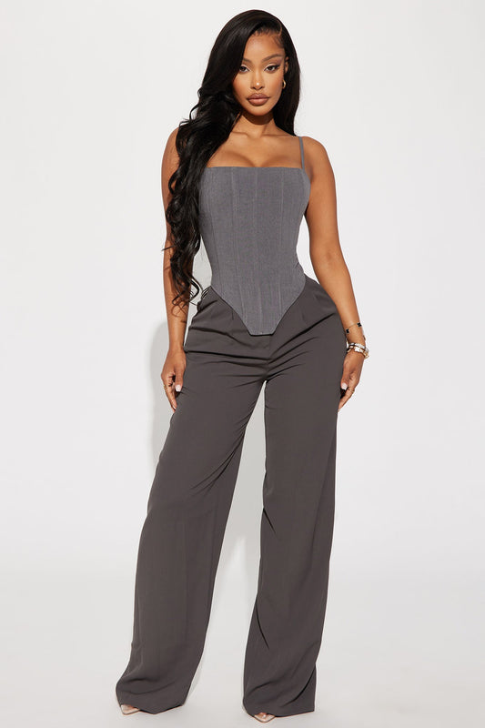 Fashion Nova grey corset top featuring a fitted design and sleek silhouette paired with wide leg trousers