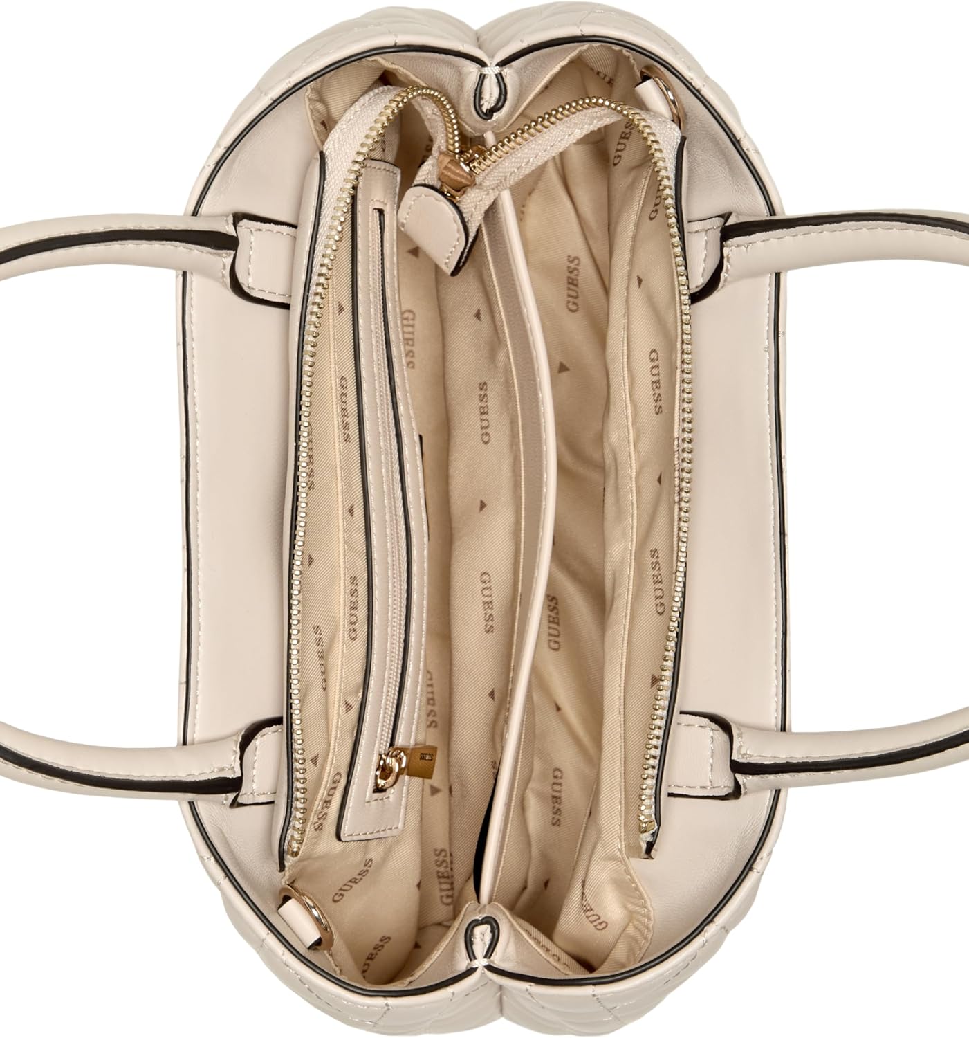 Top view inside GUESS black satchel handbag showing beige logo lining gold zippers and compartments