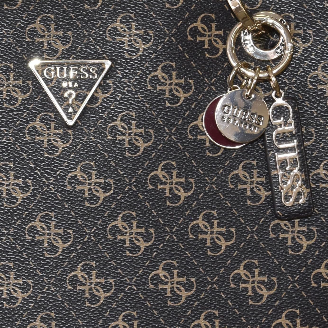 GUESS Noelle Small Tote Bag featuring signature logo design and stylish charm accents