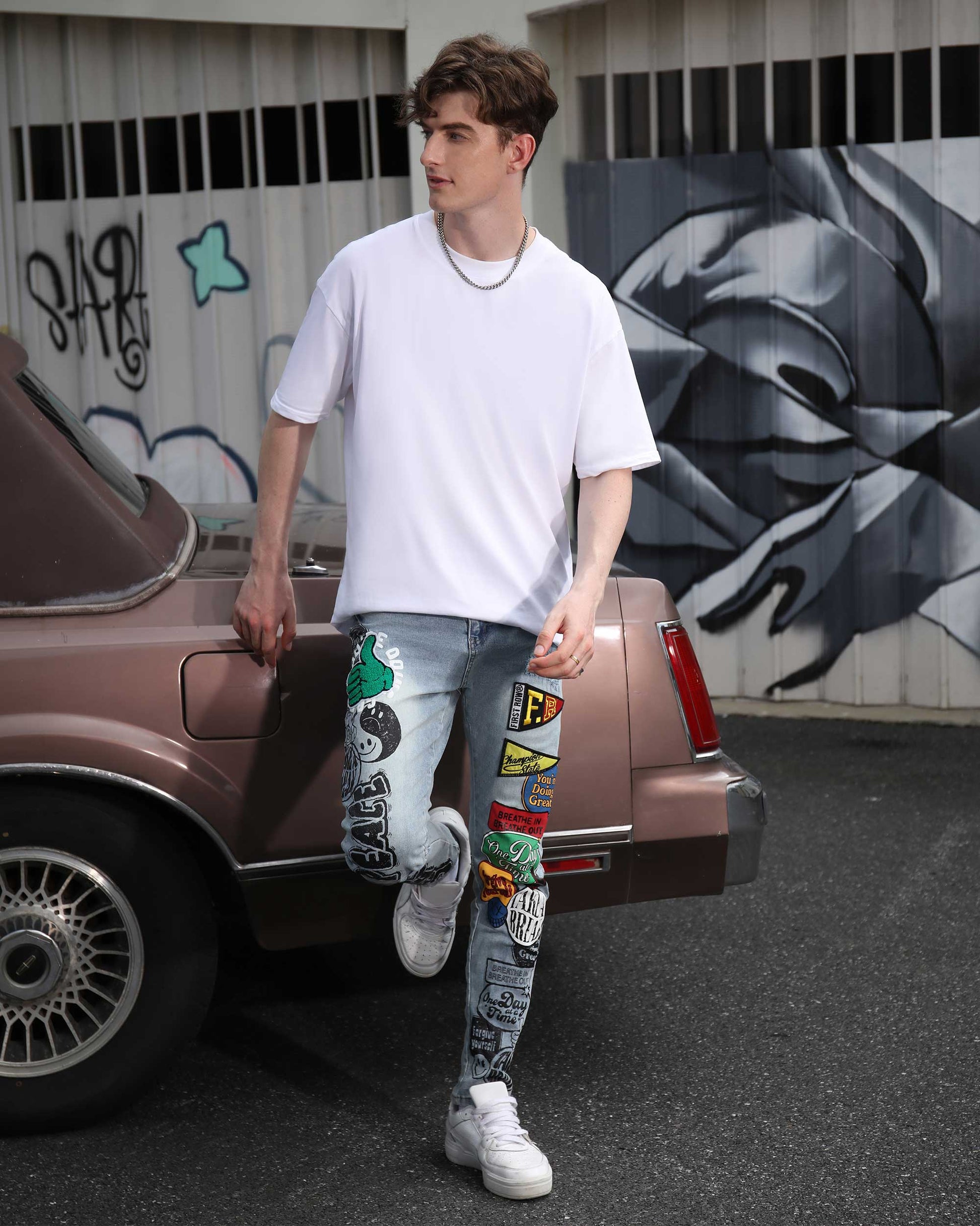 Logeqi Hip Hop Slim Fit Jeans with trendy patches and distressed design, styled with a white t-shirt