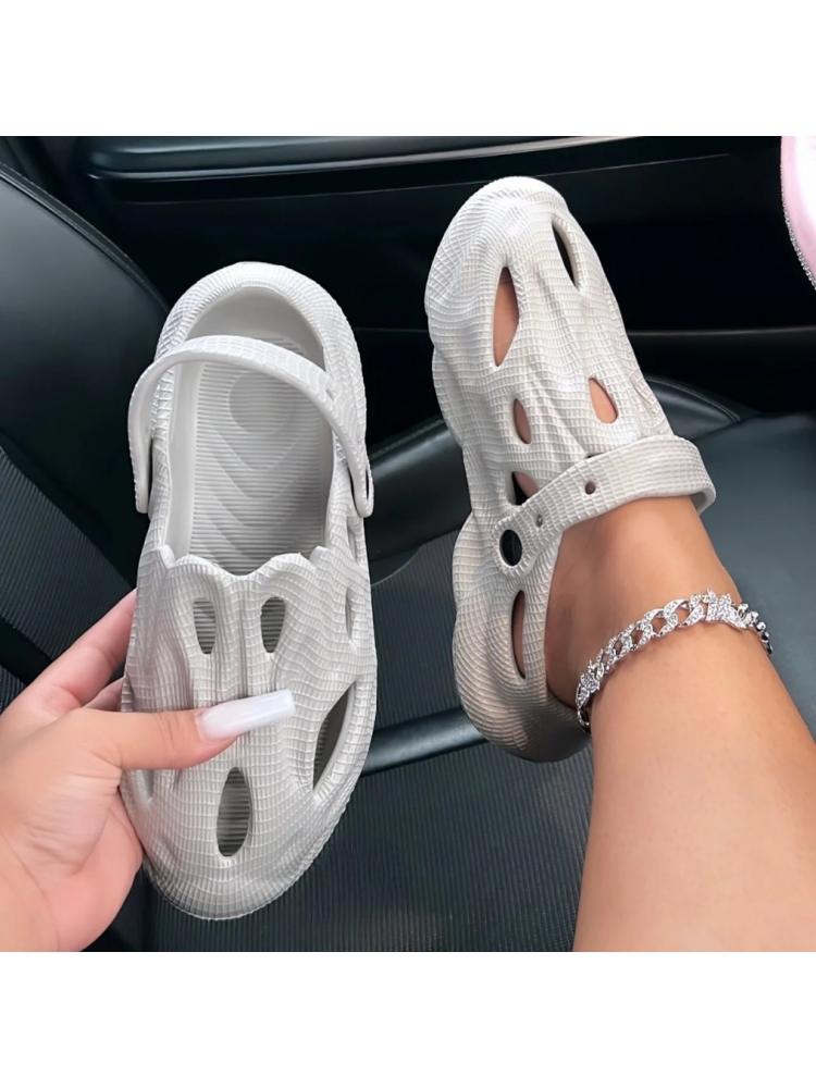 Wholesale7 hollow out leisure slippers in light gray worn on foot with adjustable strap
