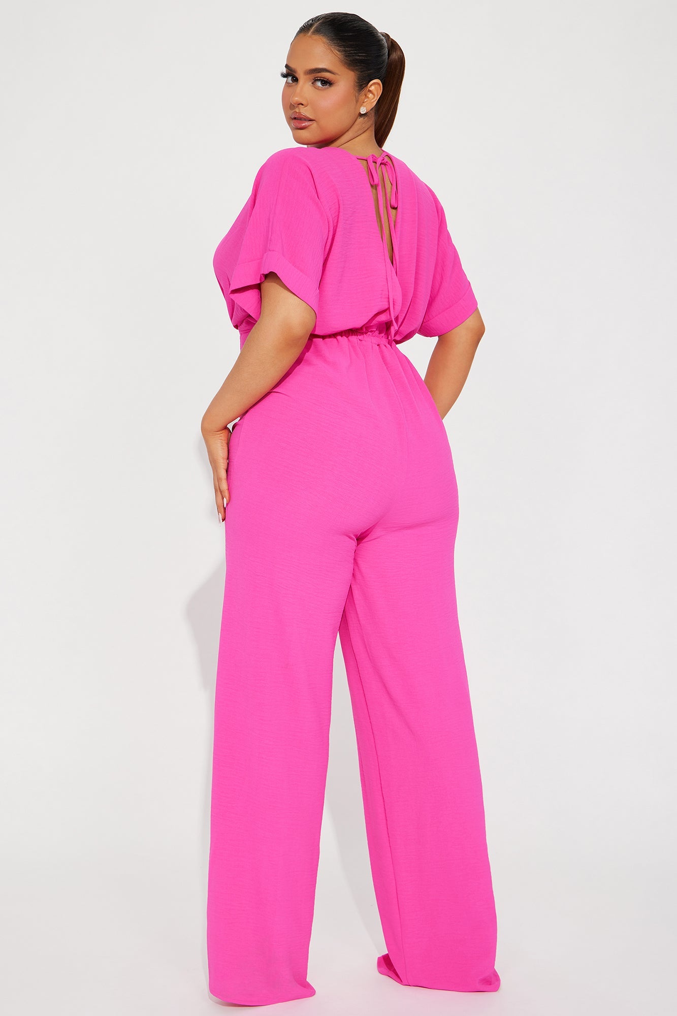 Fashion Nova hot pink jumpsuit for women with a stylish back detail and wide-leg design