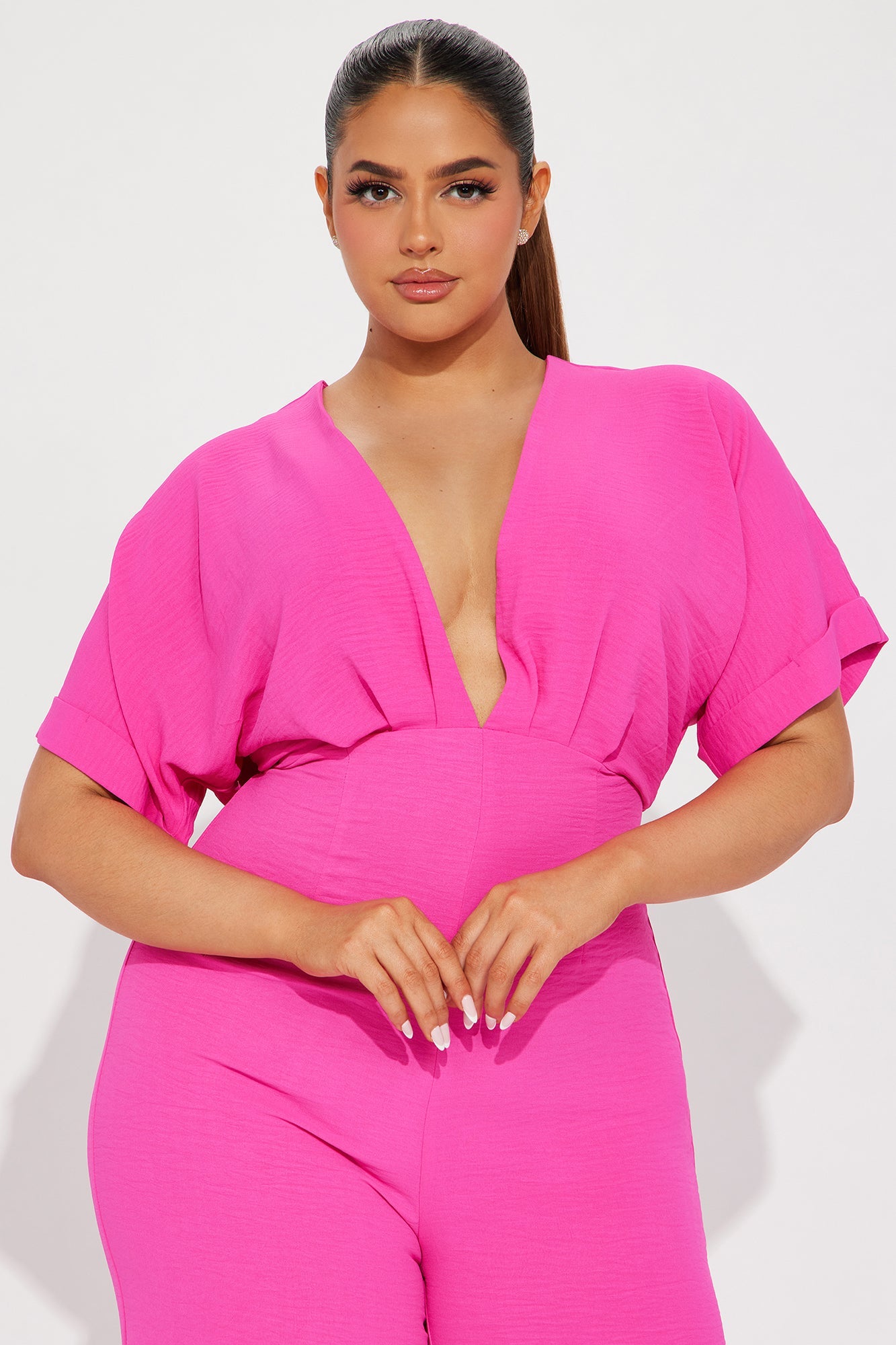 Fashion Nova hot pink jumpsuit for women with a deep V-neck and stylish short sleeves