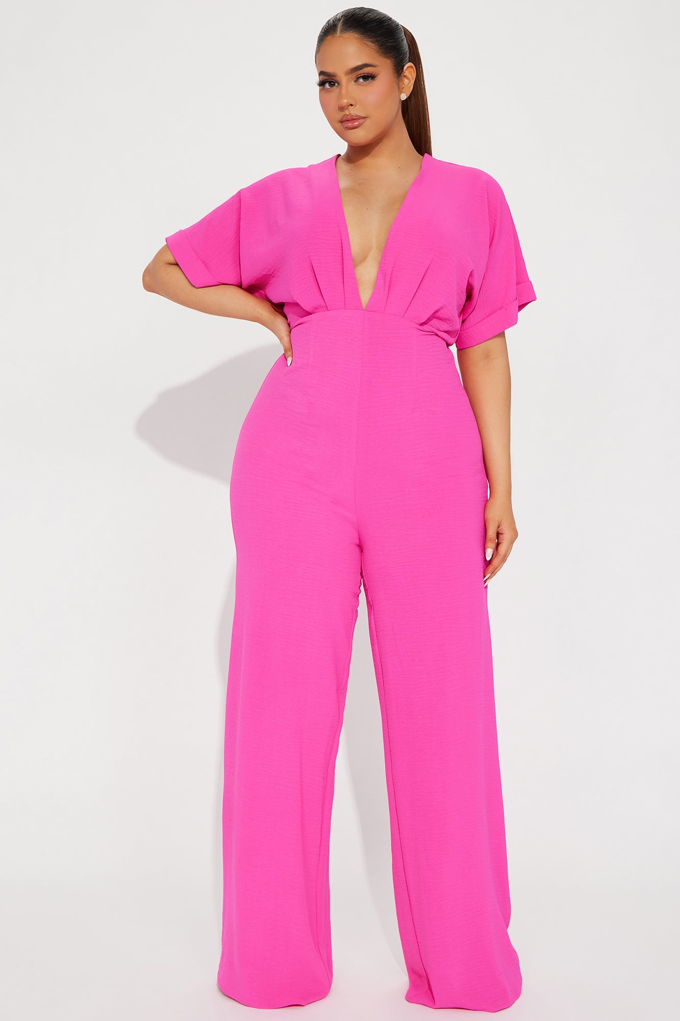 Fashion Nova hot pink jumpsuit for women with a deep V-neck and wide-leg design