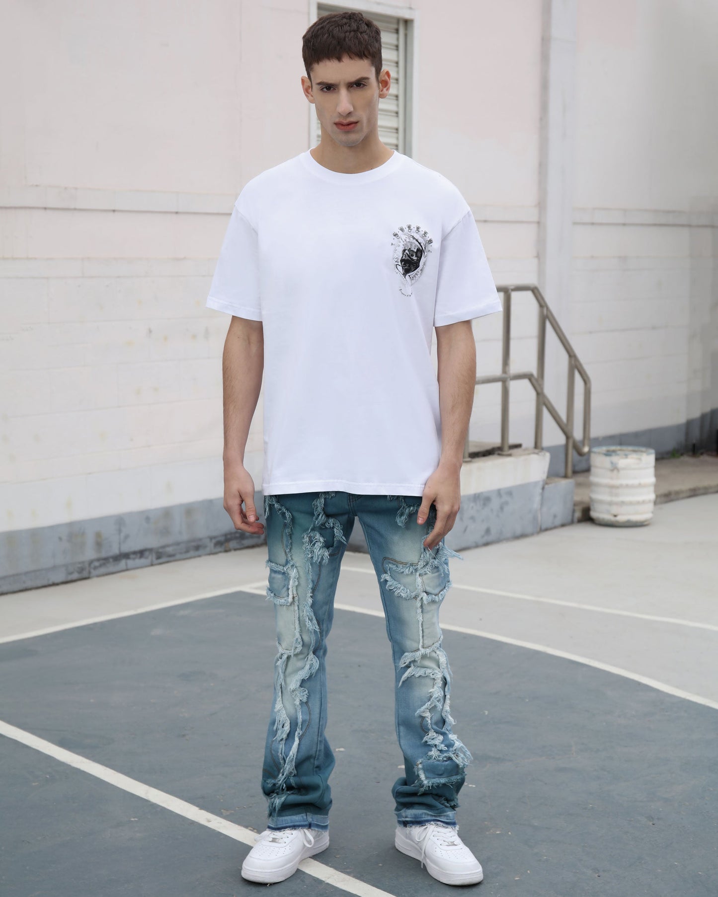 Logeqi irregular blue stacked jeans featuring distressed detailing and a modern fit