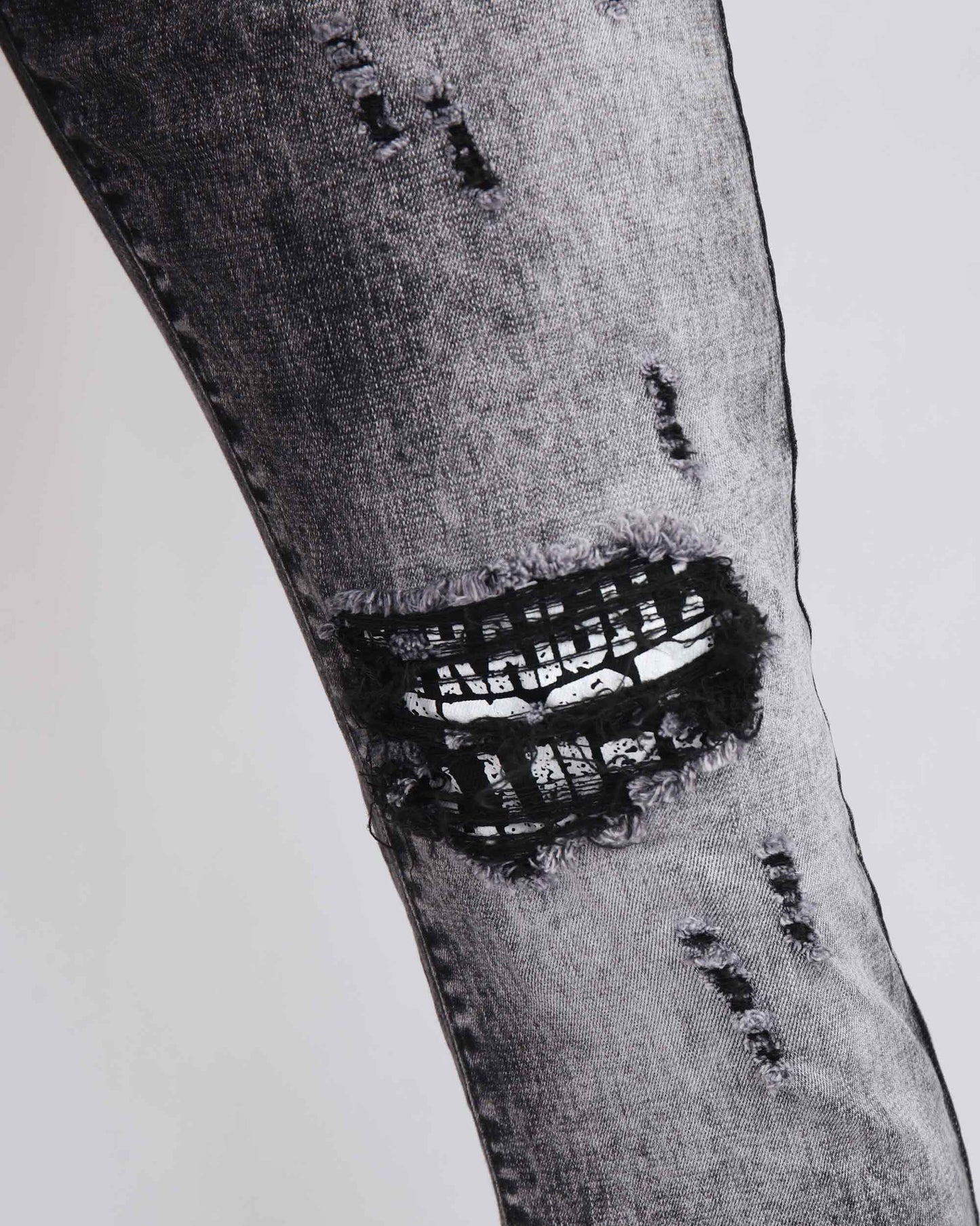 Logeqi Irregular Wash Ripped Jeans featuring distressed details and unique texture for a trendy look