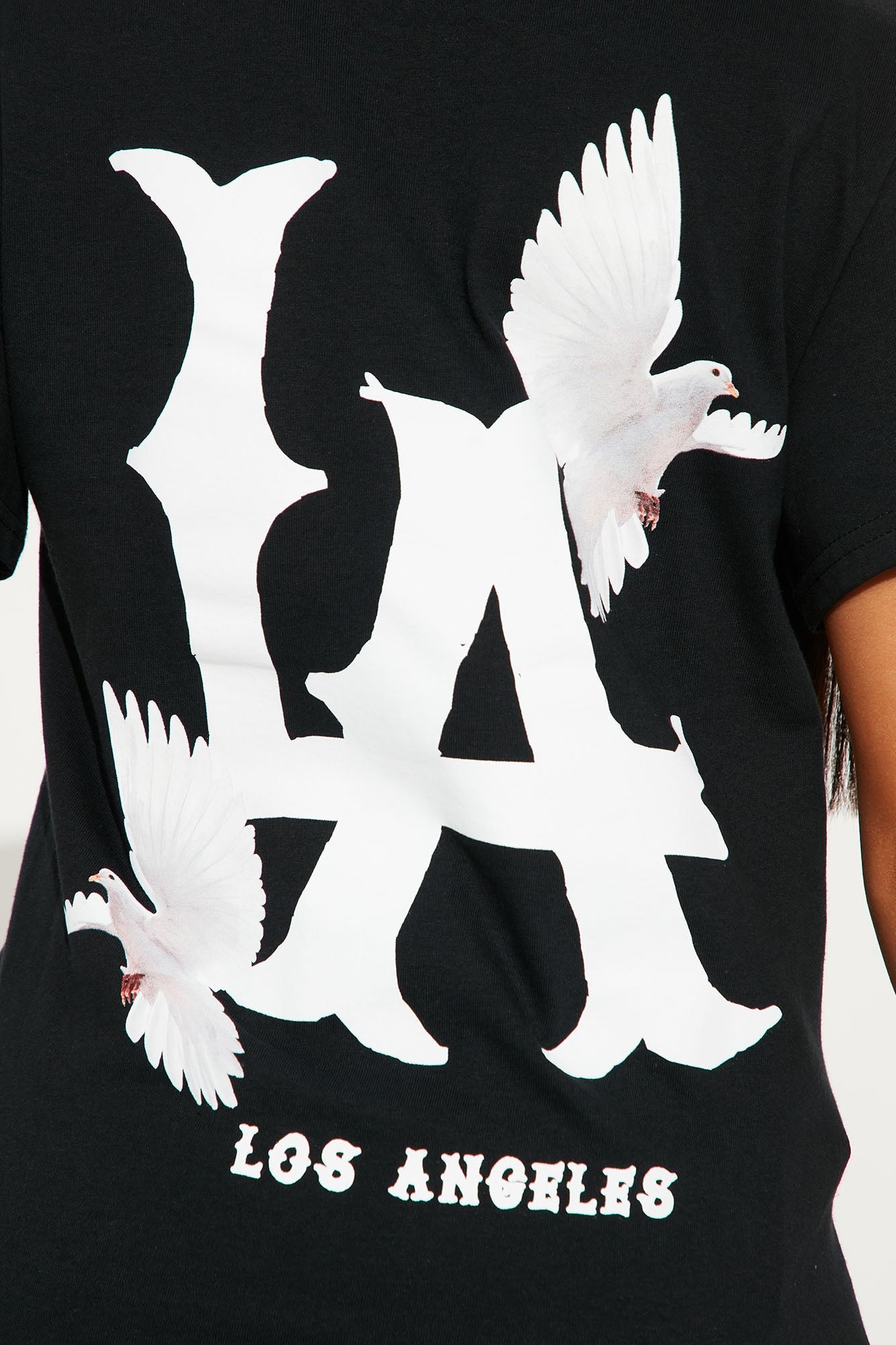 LA City black graphic tee featuring bold lettering and bird graphics on the back for a stylish look