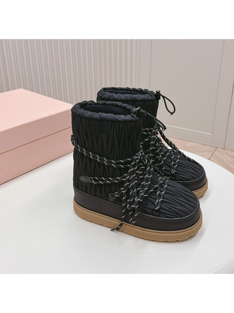 Wholesale7 black lambswool snow boots with quilted design and thick brown sole