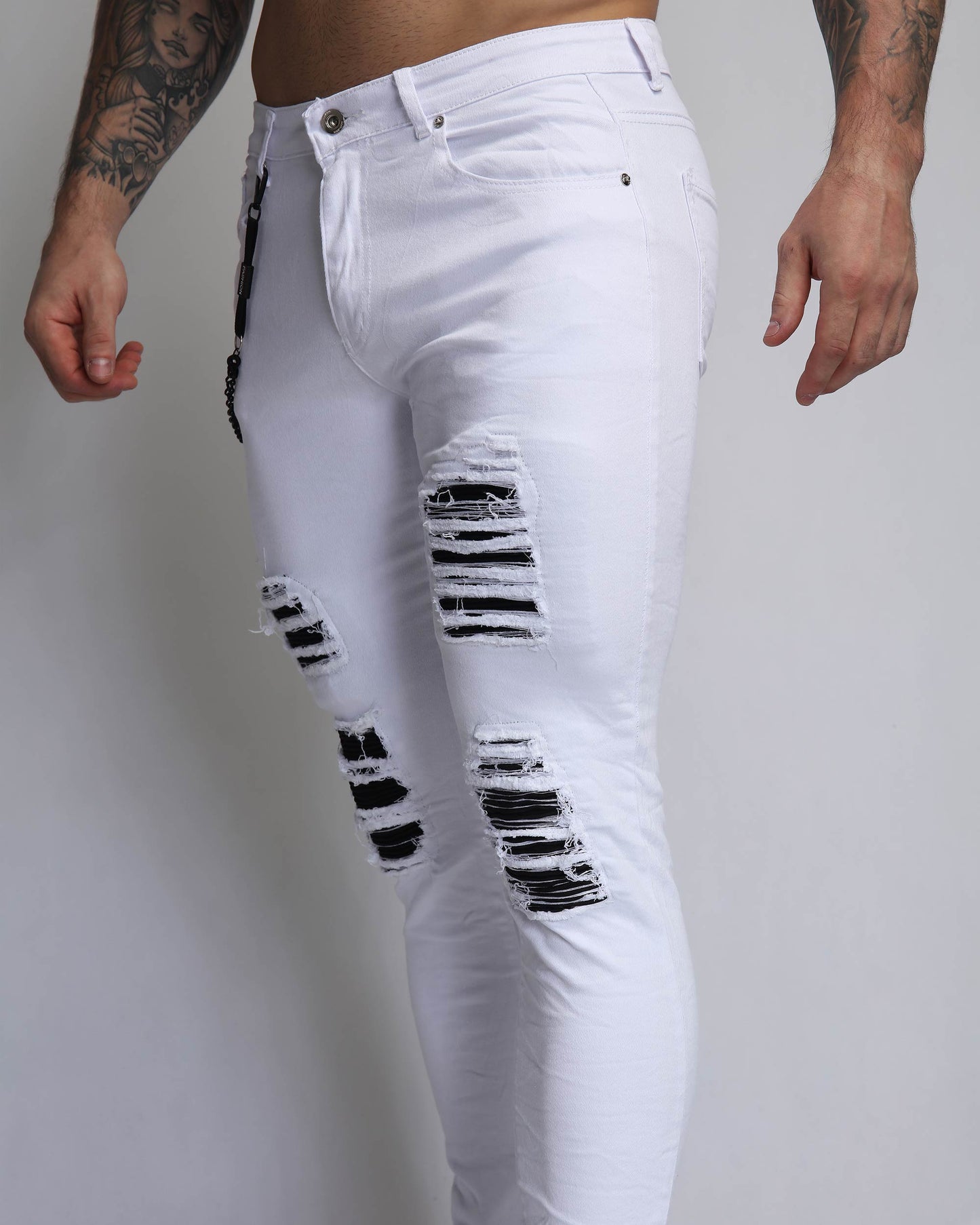 Logeqi large white ripped jeans featuring stylish distressed detailing and a slim fit