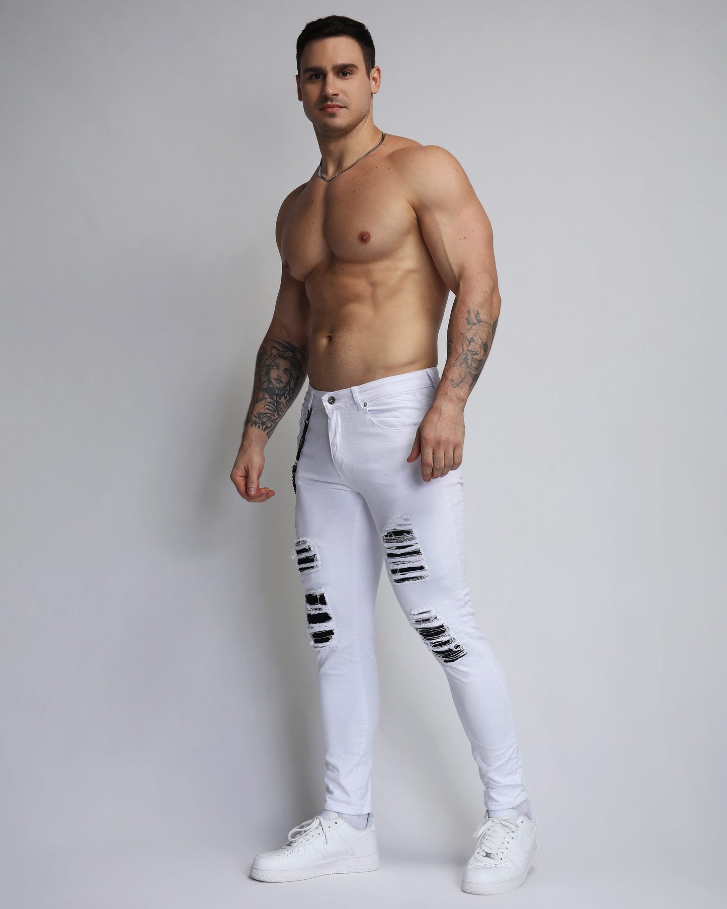 Stylish large white ripped jeans by Logeqi with a modern slim fit and distressed detailing