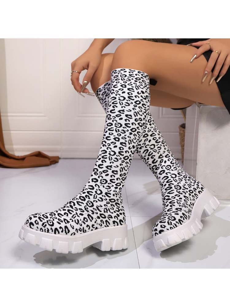 Leopard print chunky heel boots with a stylish design and comfortable fit for trendy outfits