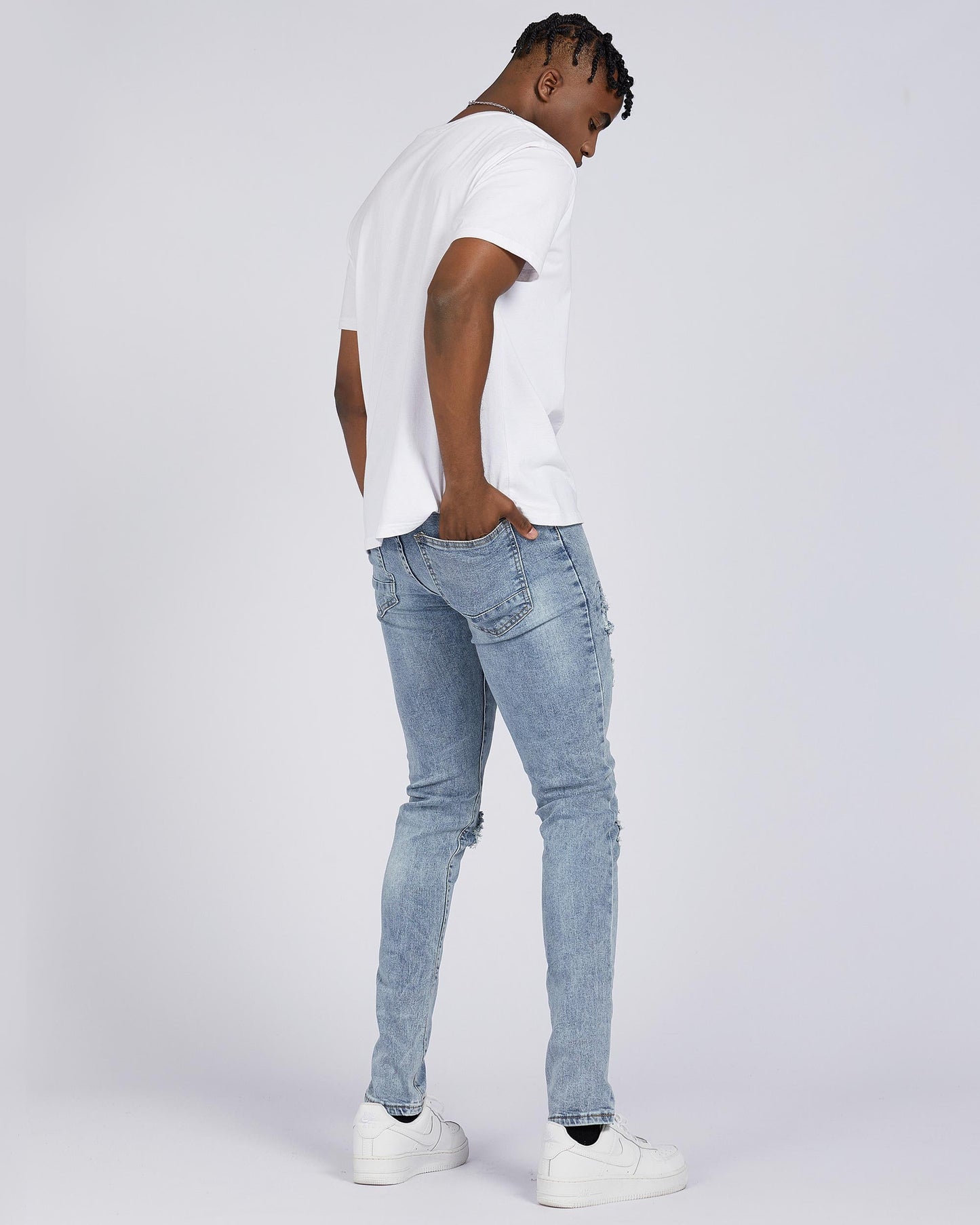 Logeqi light wash blue ripped jeans featuring a slim fit design perfect for casual wear